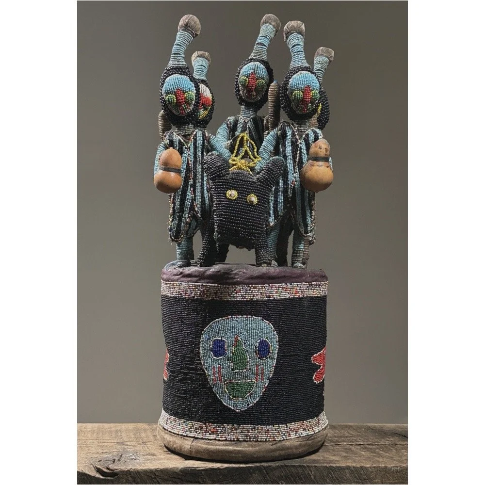 Full frontal view of a vintage Yoruba beaded ceremonial headdress with central equestrian figure