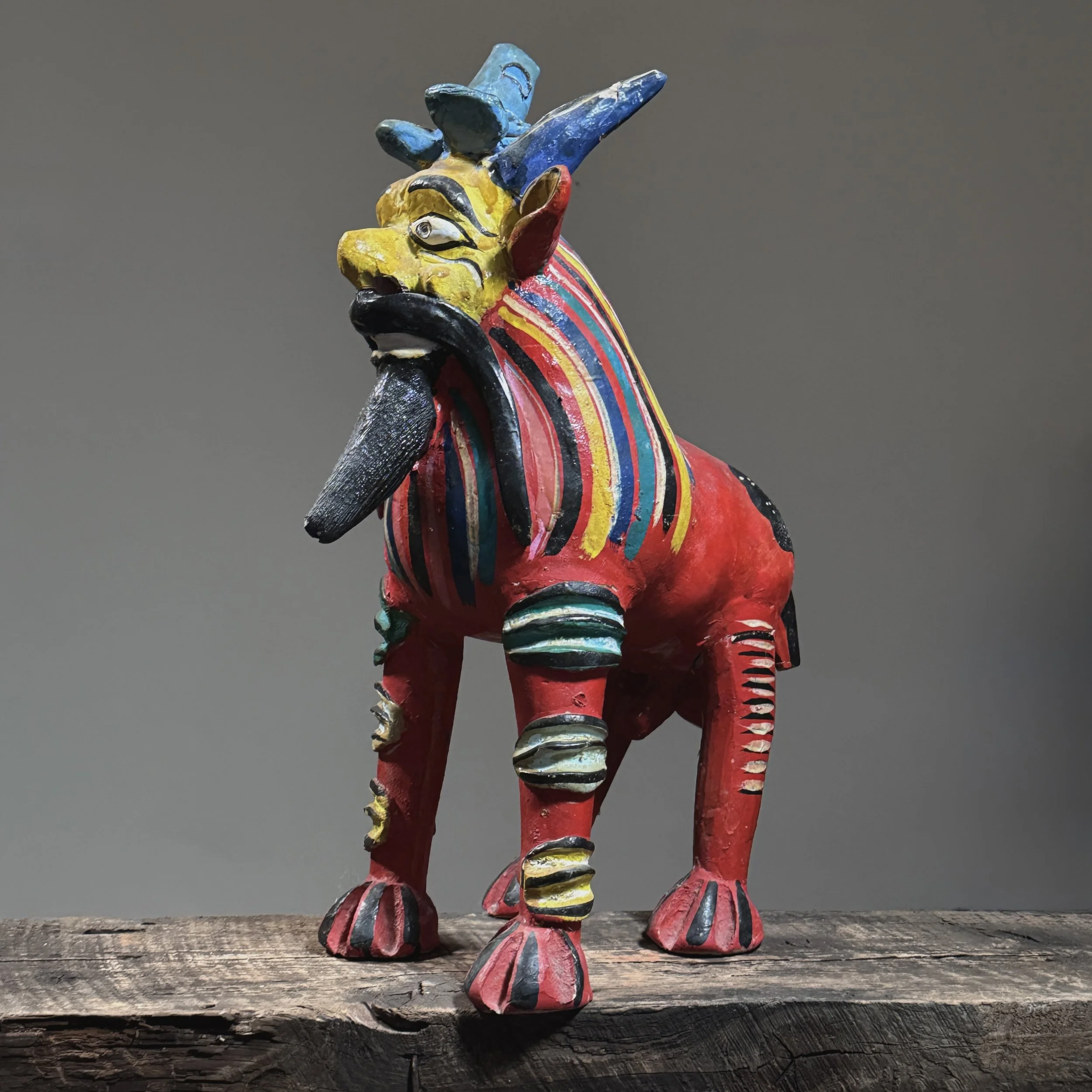Full frontal view of a vintage Candelario Medrano Mexican folk art polychrome monster sculpture