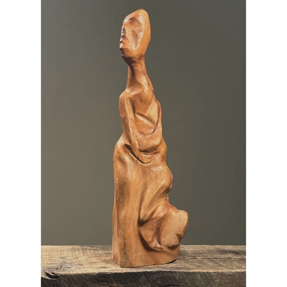Full frontal view of a vintage abstract folk art figurative root sculpture with natural wood patina