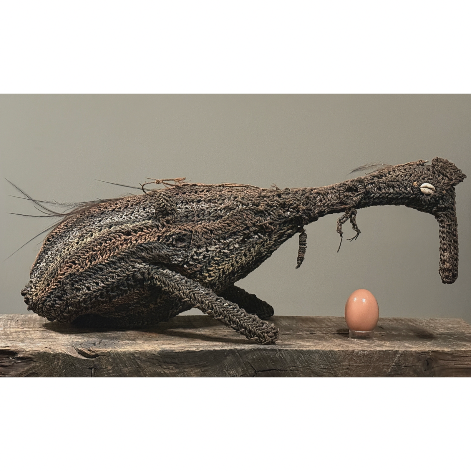 Pair of Iatmul Tribe Dream Vehicles. Woven bush fiber birds. Sepik River, Papua New Guinea. Cowrie shell eyes.  Egg for size reference.