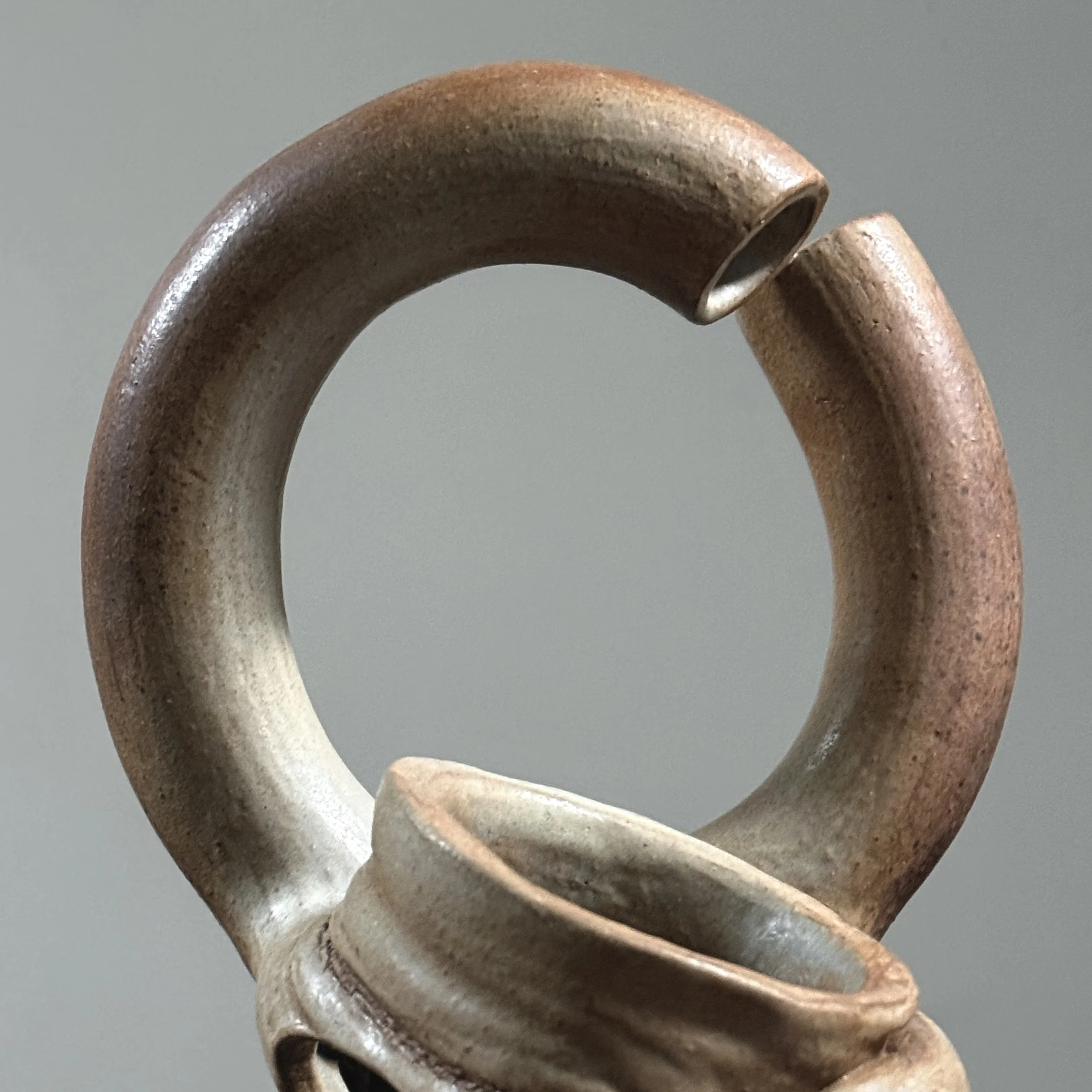 Broken circle handle detail, deconstructed ceramic vase