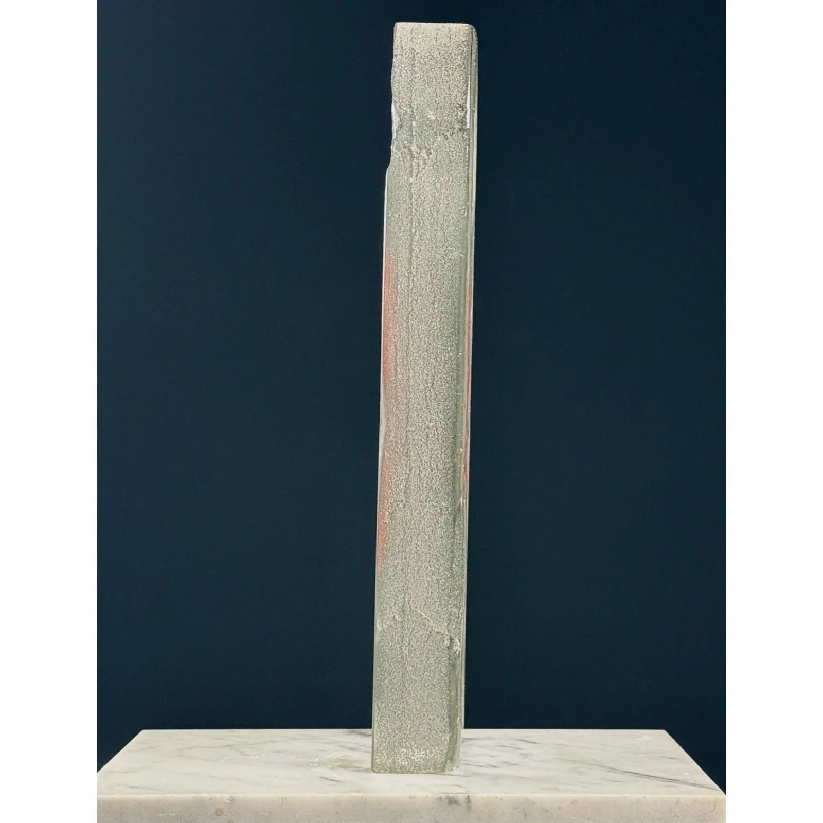 Side view of vintage Lynggaard glass sculpture showing textured edges