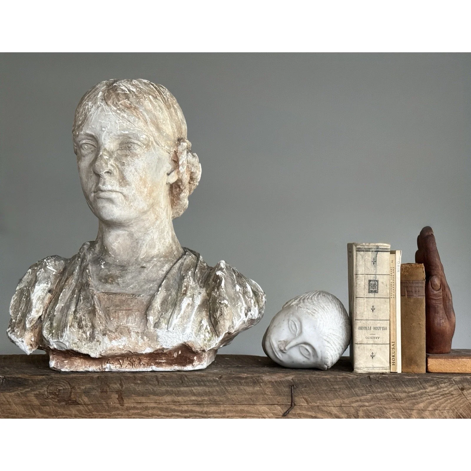 Antique Classical Revival female bust with braided hair, front view