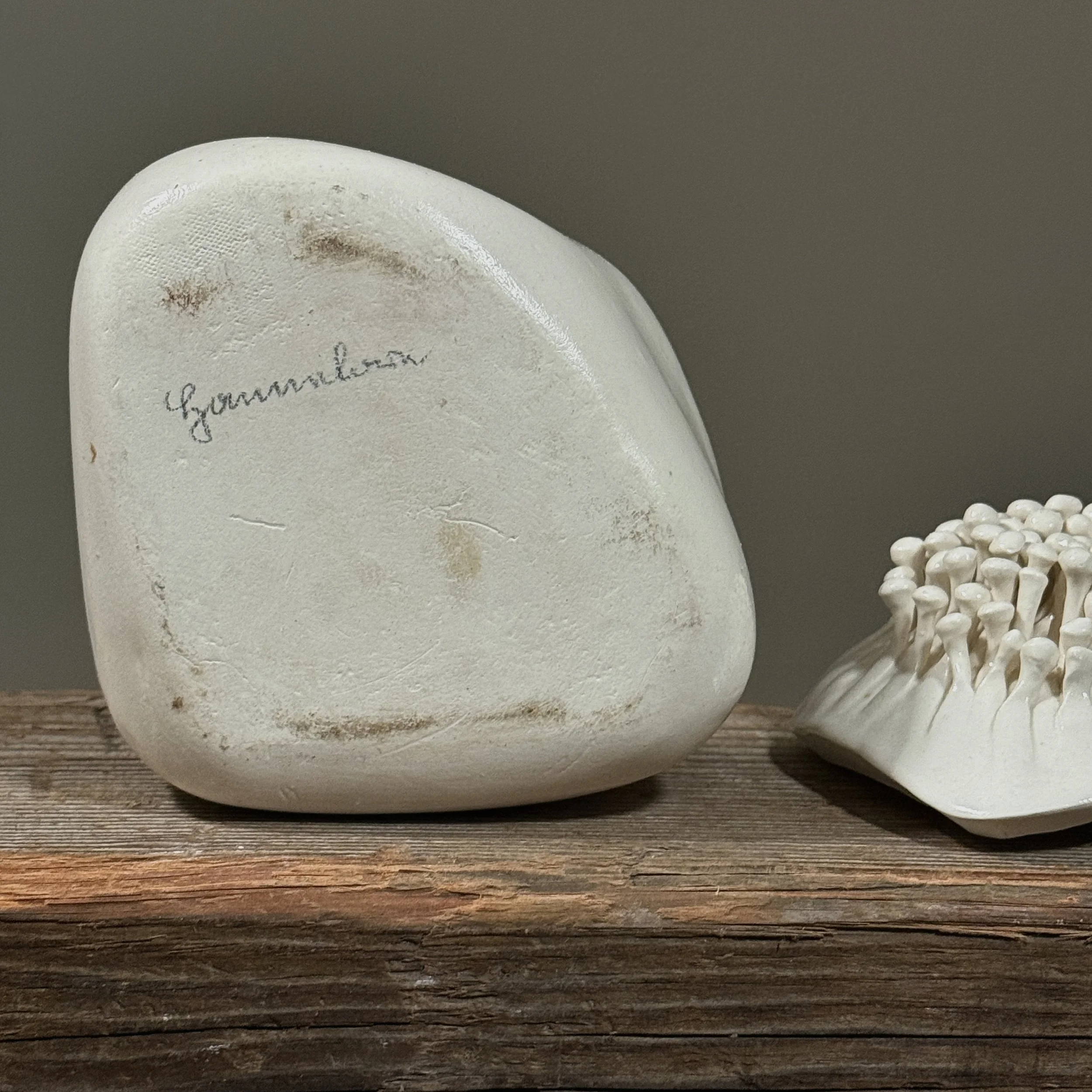 Bottom signature of Hannelore Fasciszewski on ceramic vessel