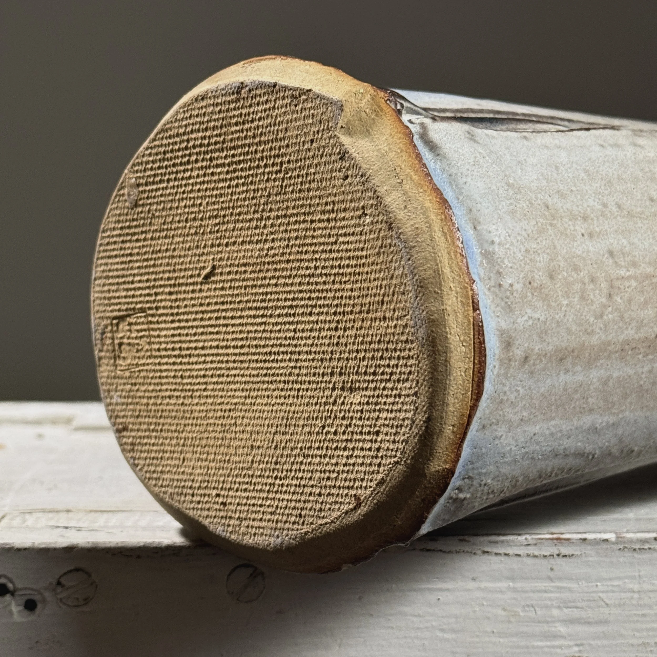 Detail of the artist's signature stamped on the underside of a Seiko Kato Behr ceramic work