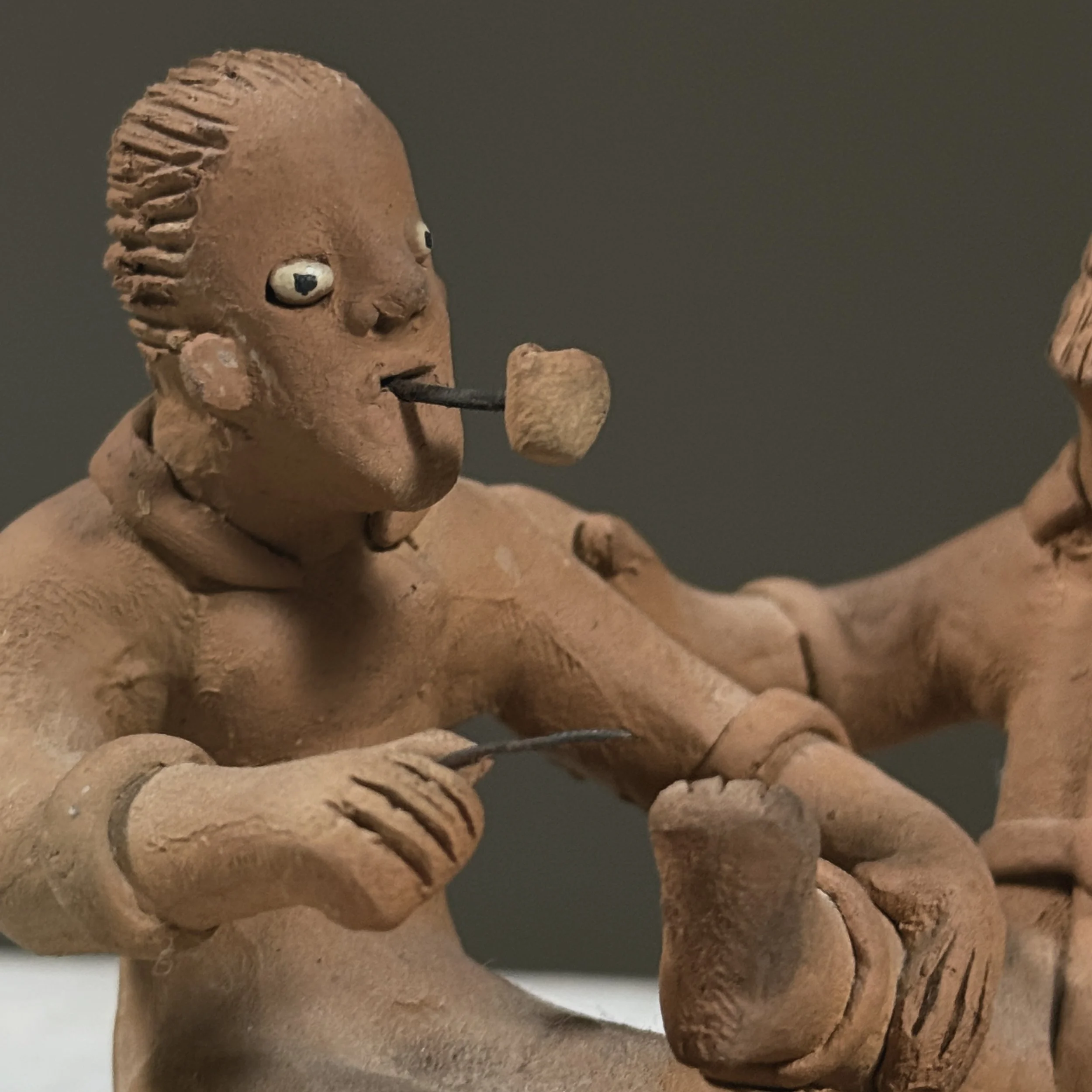 Vintage Brazilian folk art clay sculpture of two figures, signed Berenice
