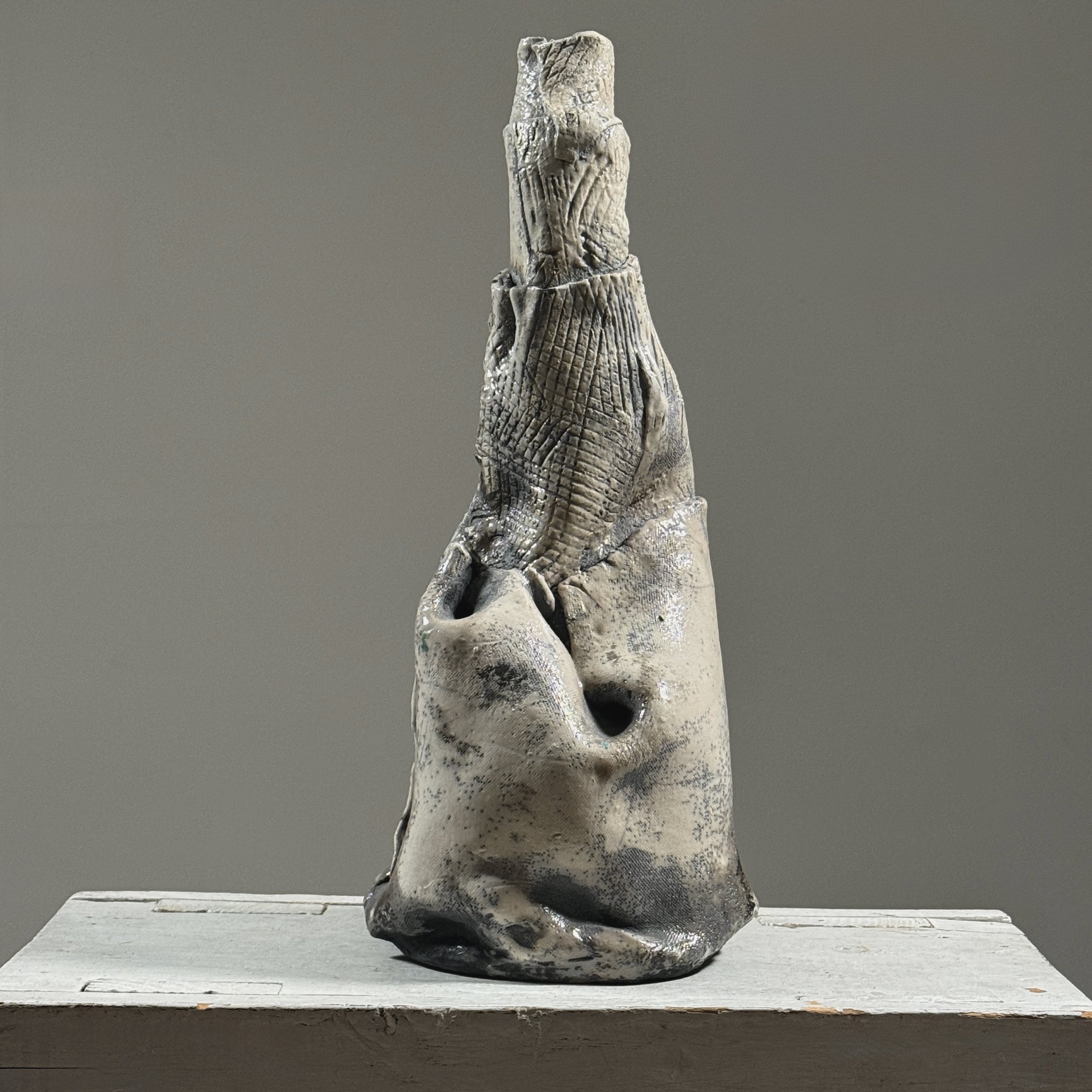 Postmodern abstract raku fired white glazed ceramic vessel