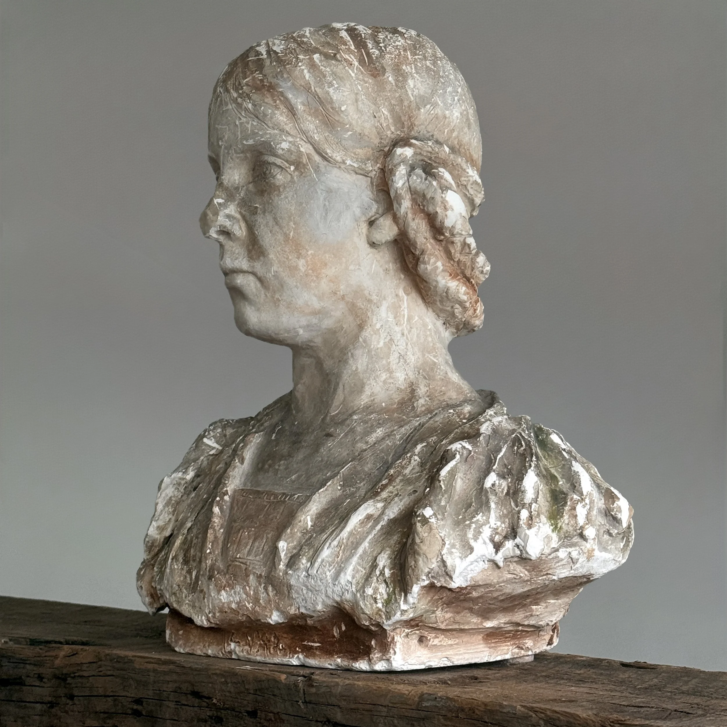 Side profile of Renaissance-inspired bust showing braided hairstyle