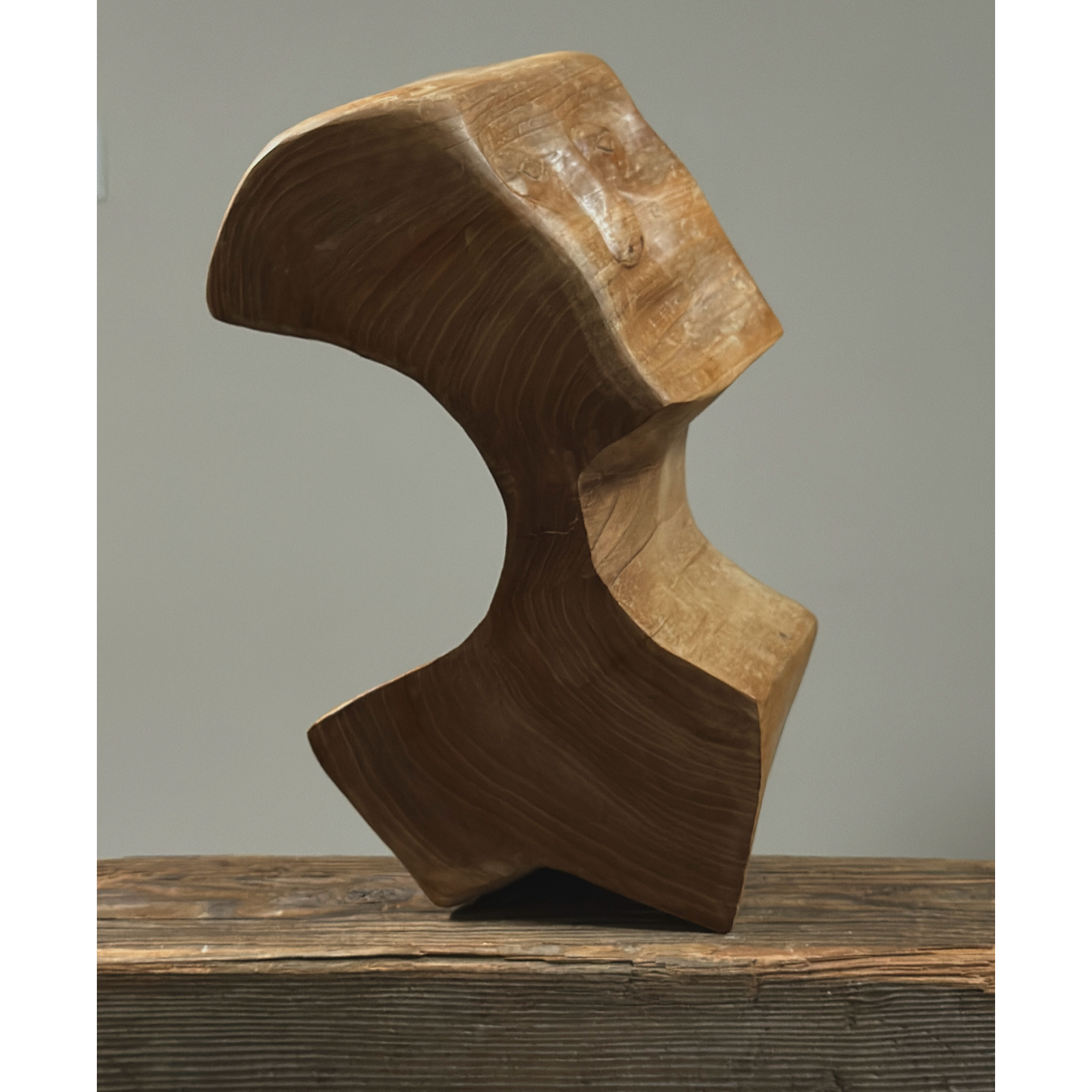 Three-quarter view of vintage hand carved Danish cubist sculpture, portrait form, wood, geometric carving