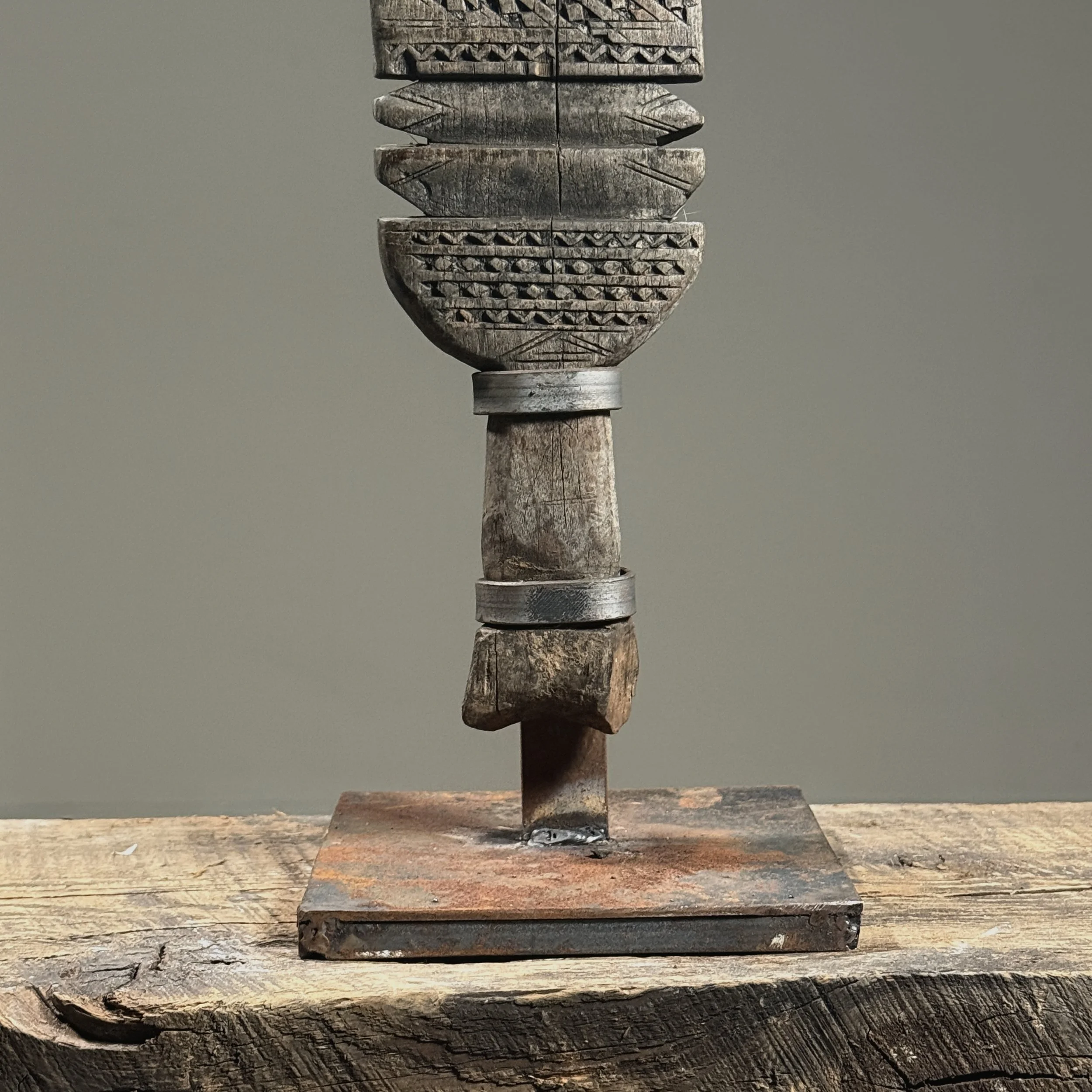 Detail of the patinated iron custom display stand.