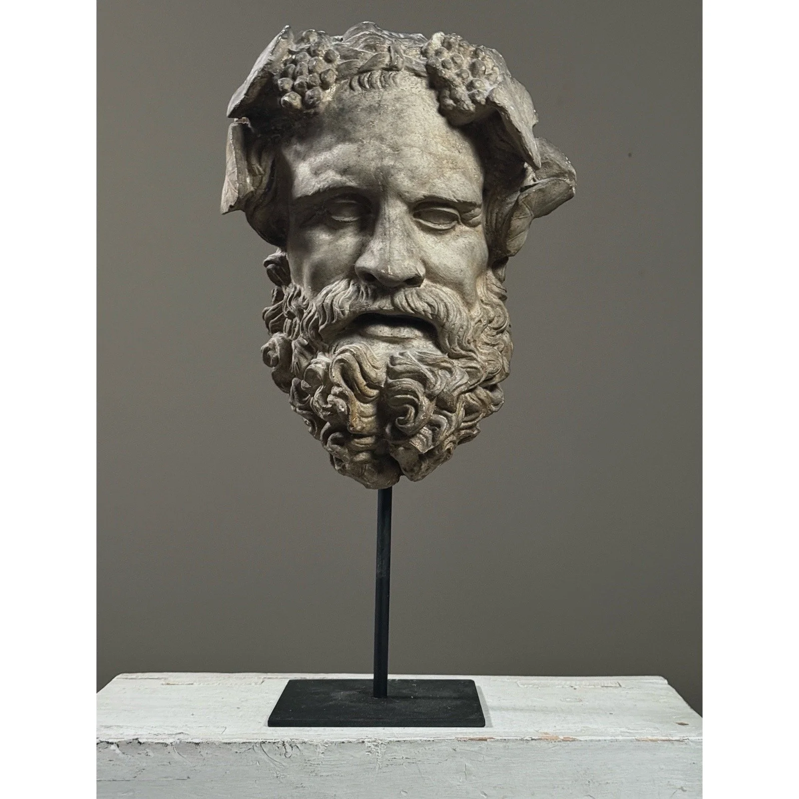 Antique neoclassical plaster mask of the mythological figure Silenus, front view