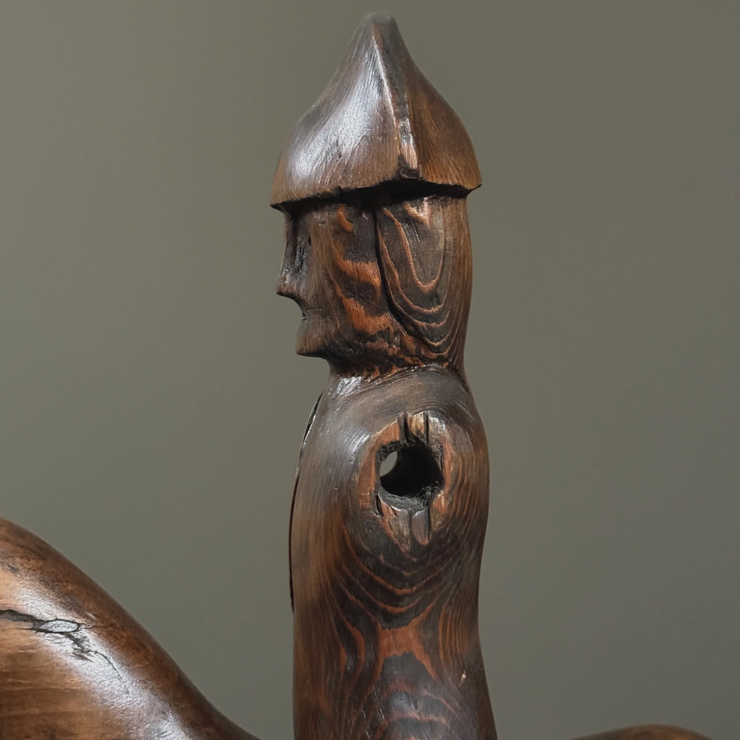 Angle showing deliberate arm omission as part of design.