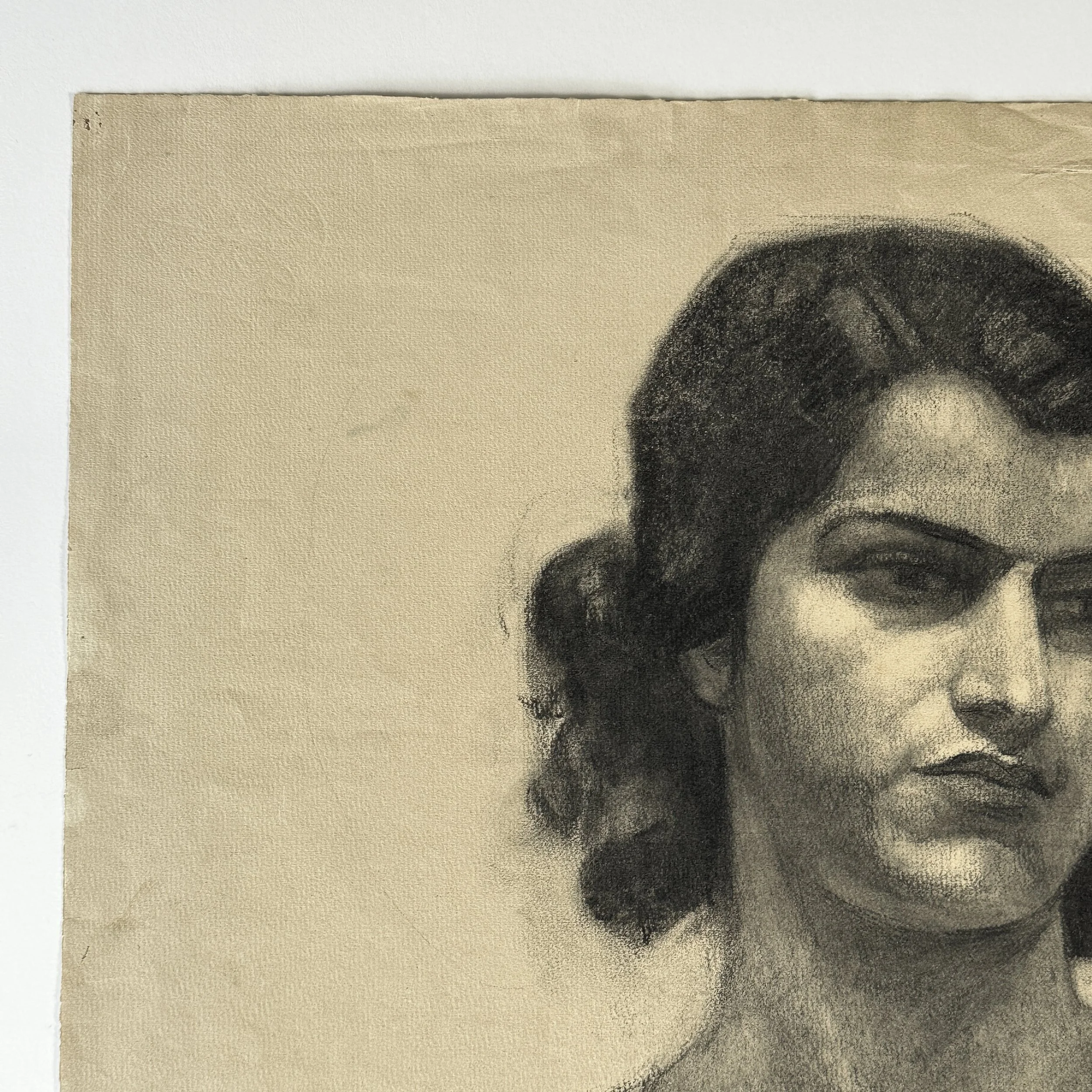 Cream wove paper with visible deckled edges and wear