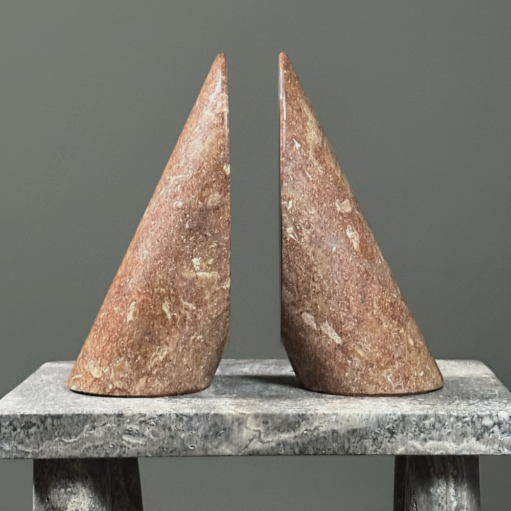 Pair of vintage Italian Modernist cylindrical stone bookends. Rosy brown. Each 7.75 inches high.