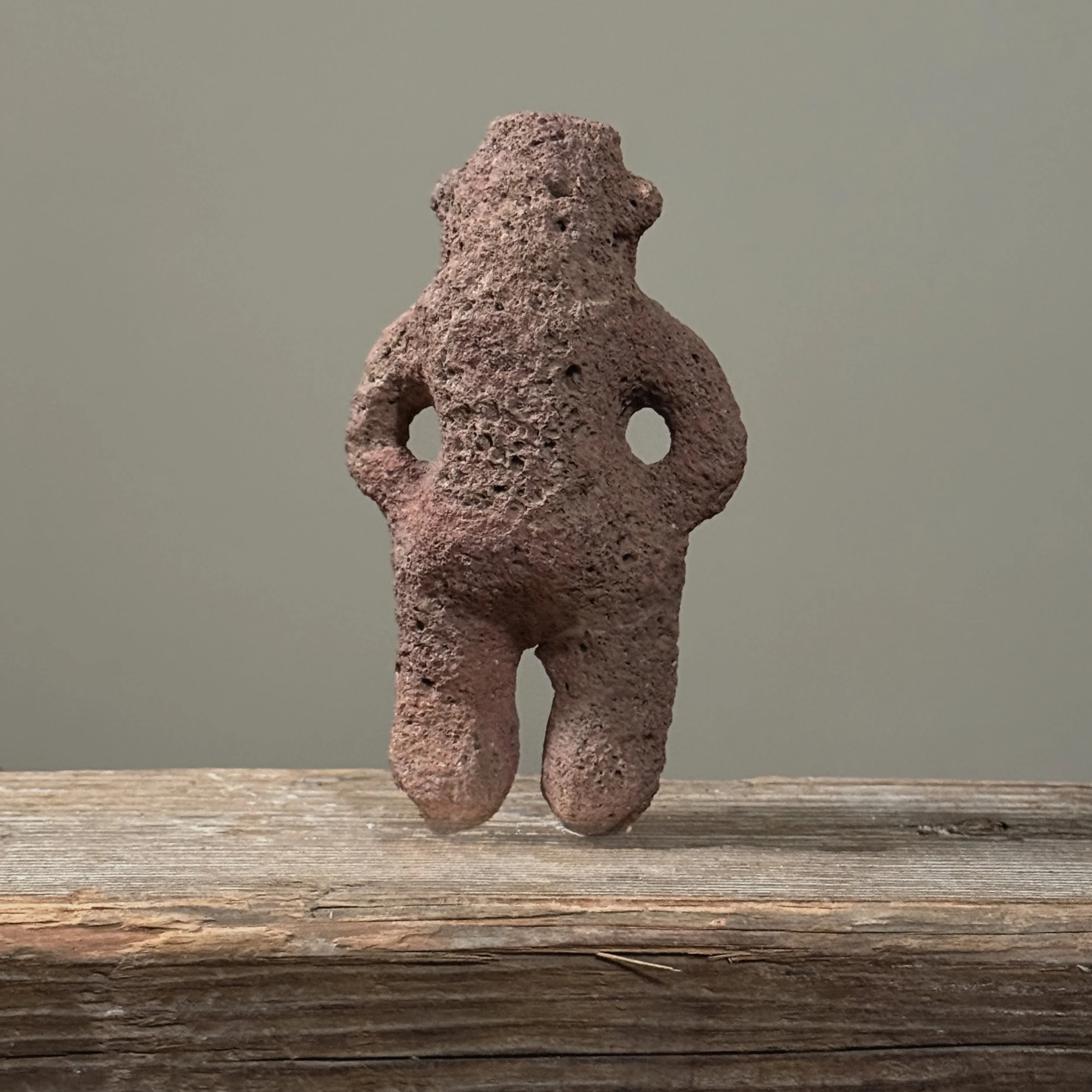 Rear view of the stone figure.