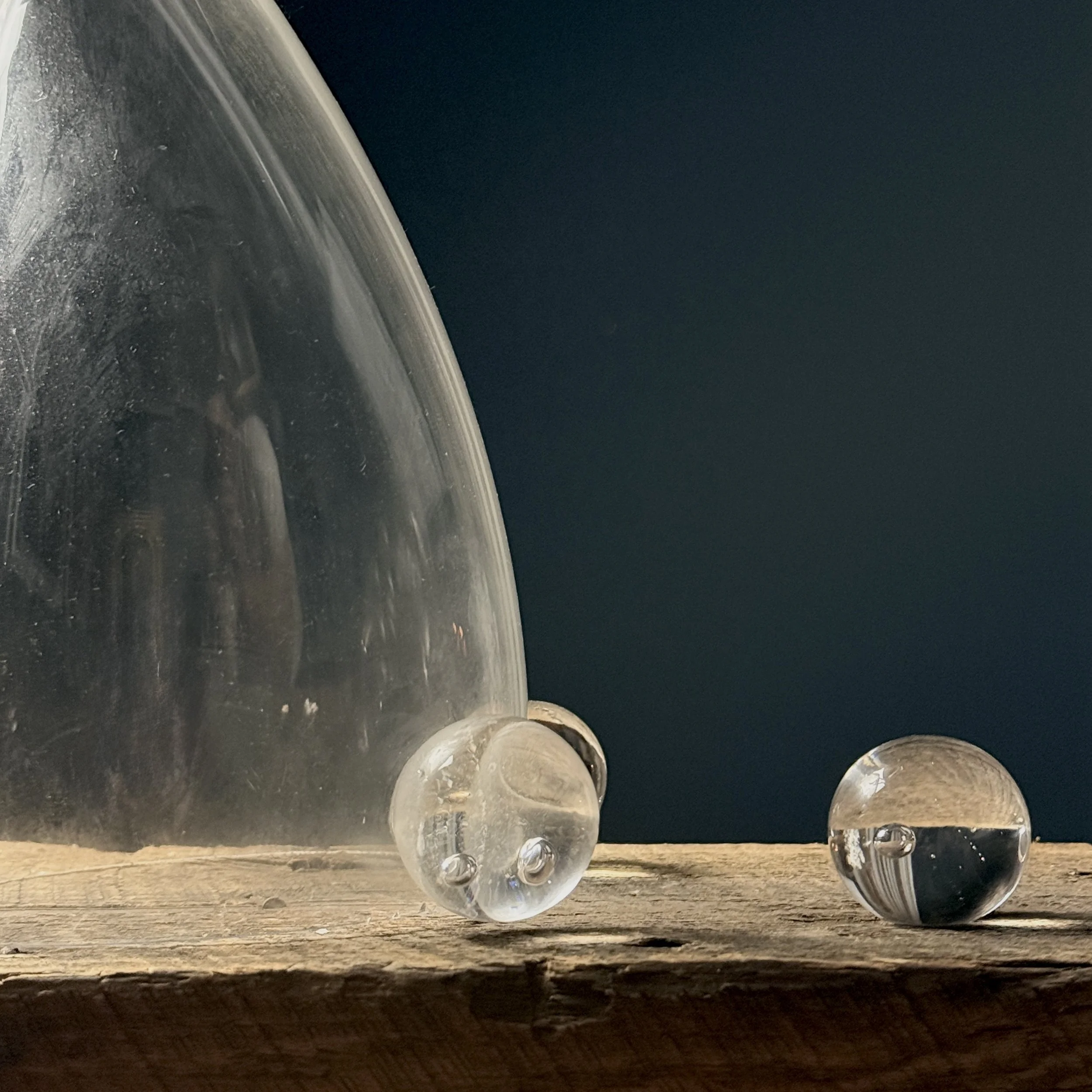 Close-up of delicate glass spheres attached to main sculptural form