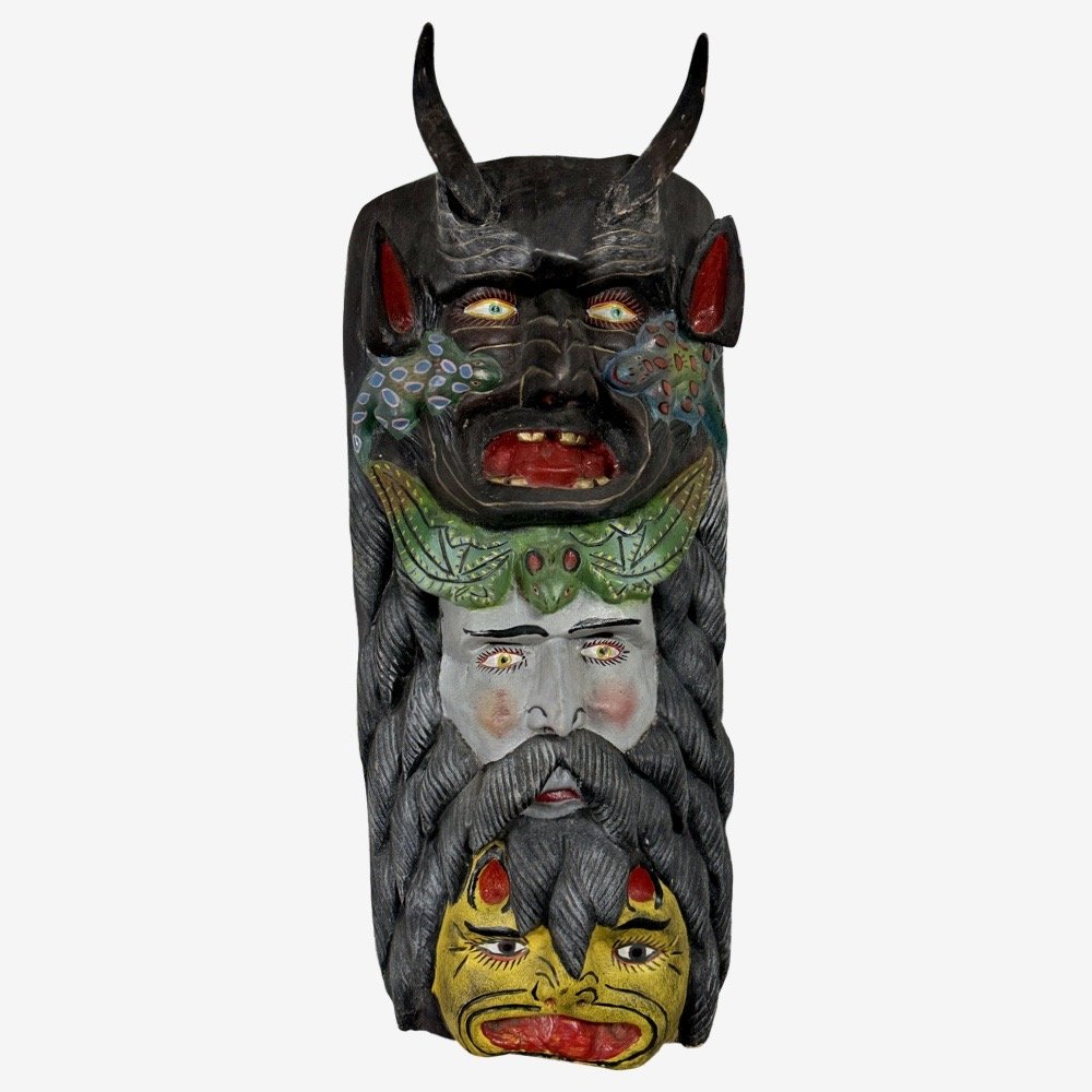 Full frontal view of a large, multi-figure Mexican polychrome wooden mask.