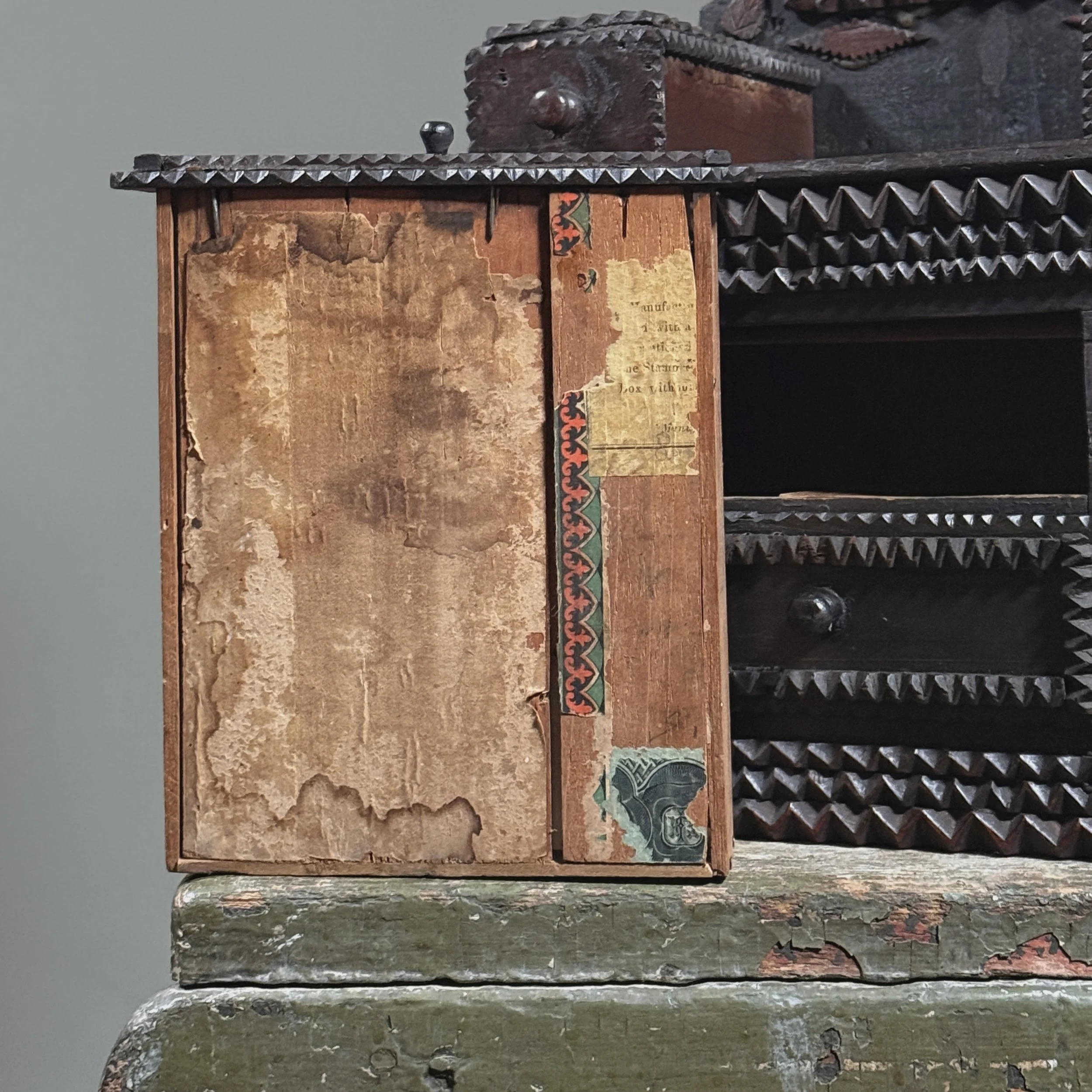 Close-up of the original cigar box label inside a drawer.