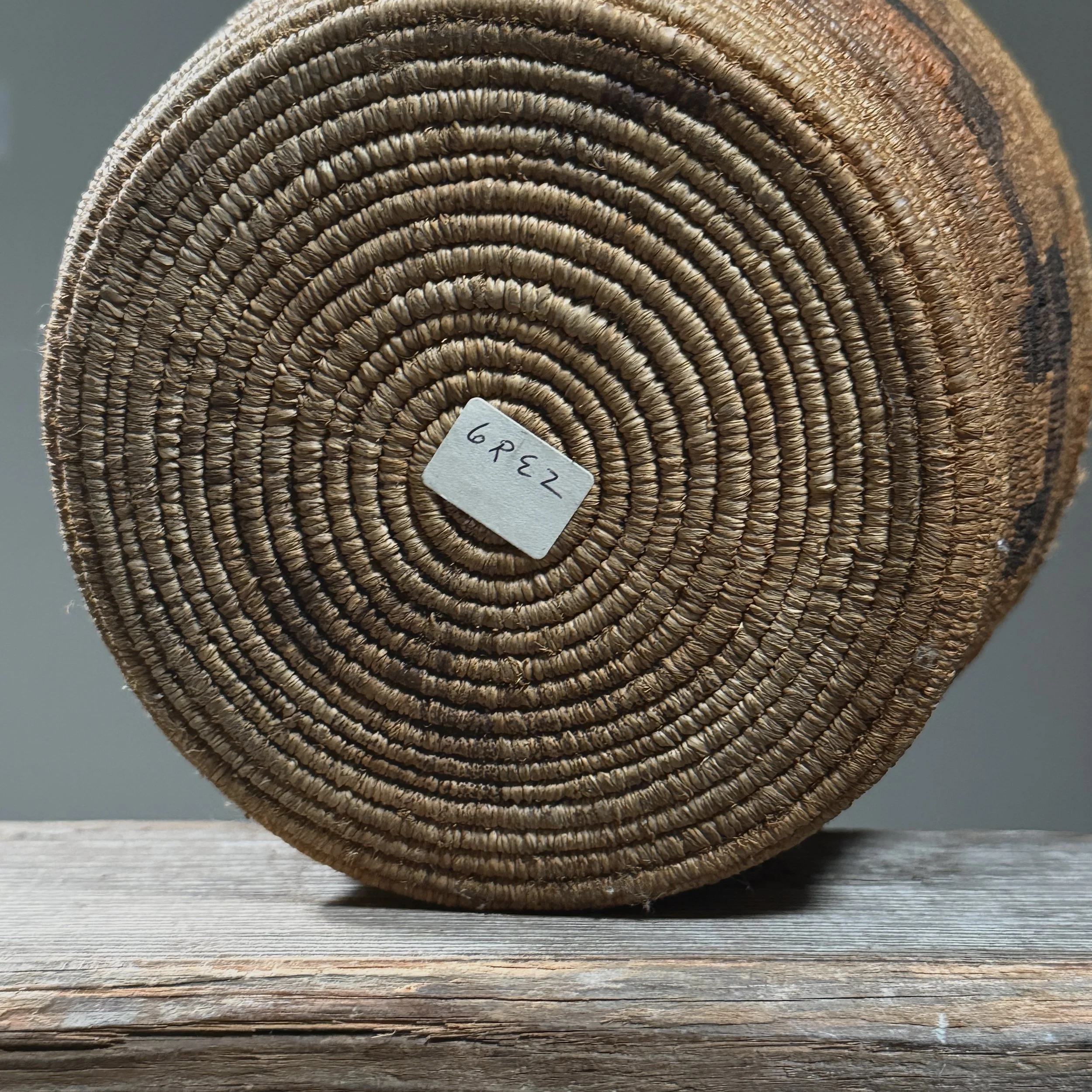 Underside view showing the original tag suggesting possible prior museum exhibition