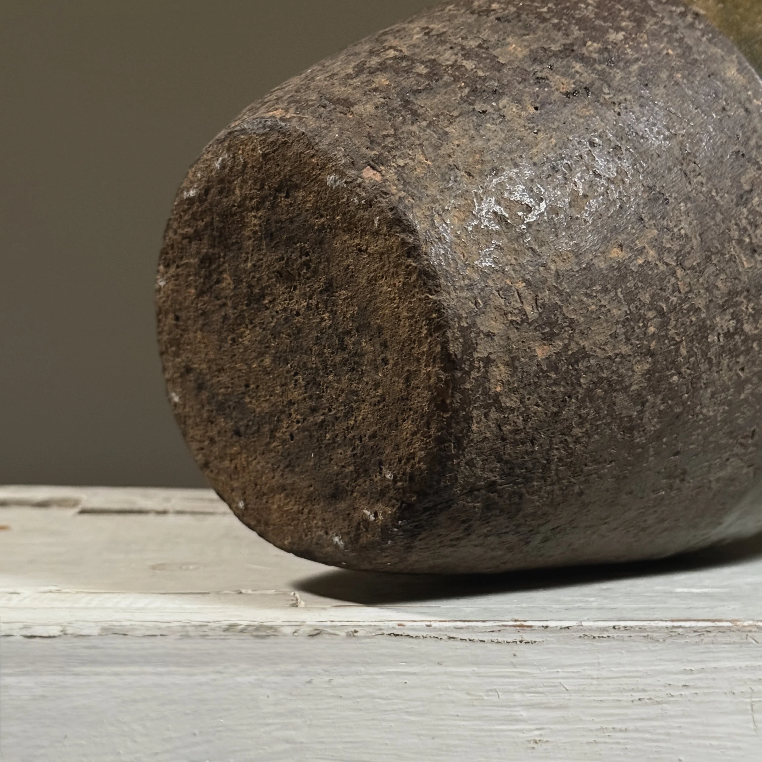 Detail of the base, showing the unglazed foot rim and exposed clay body.