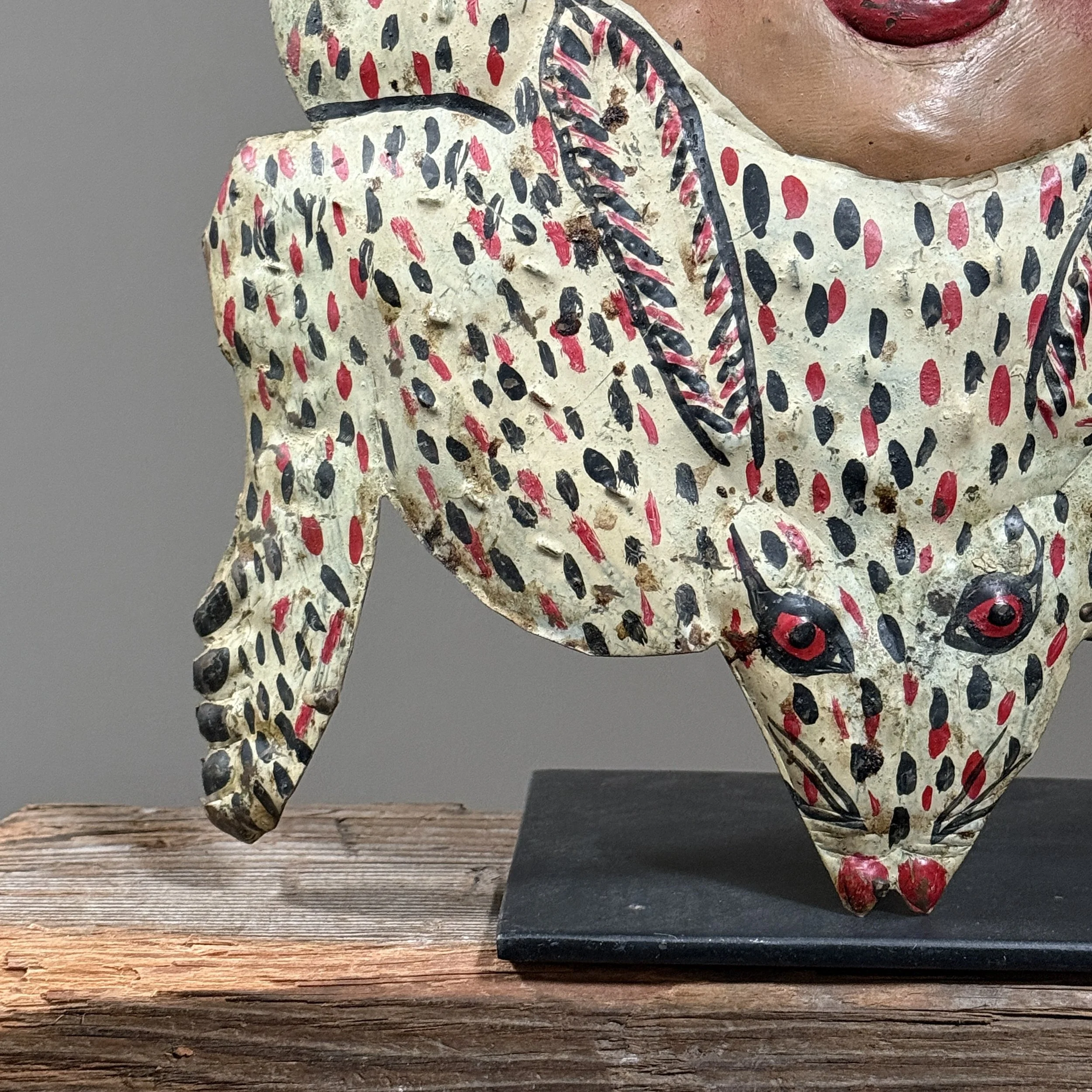Close-up of hand-painted rabbit woman mask detailing