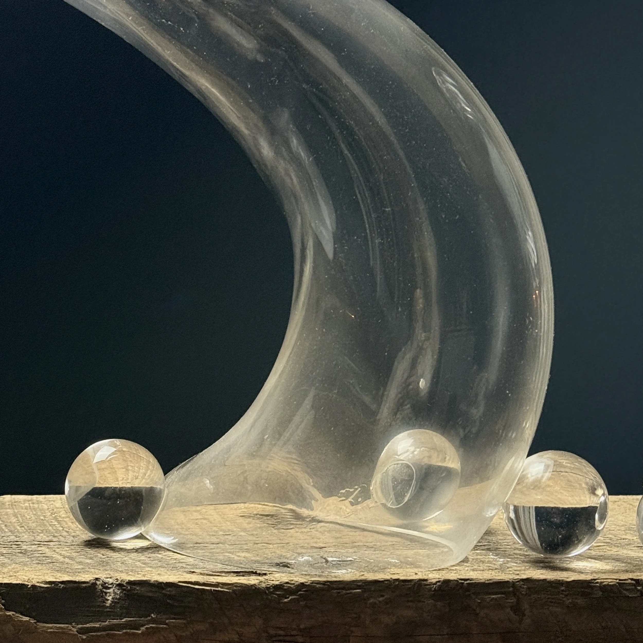 Close-up of delicate glass spheres attached to main sculptural form