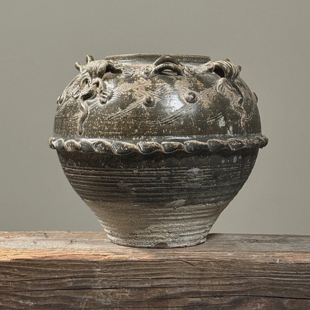 Front view of an antique 19th century Chinese brownish-green glazed stoneware vase.