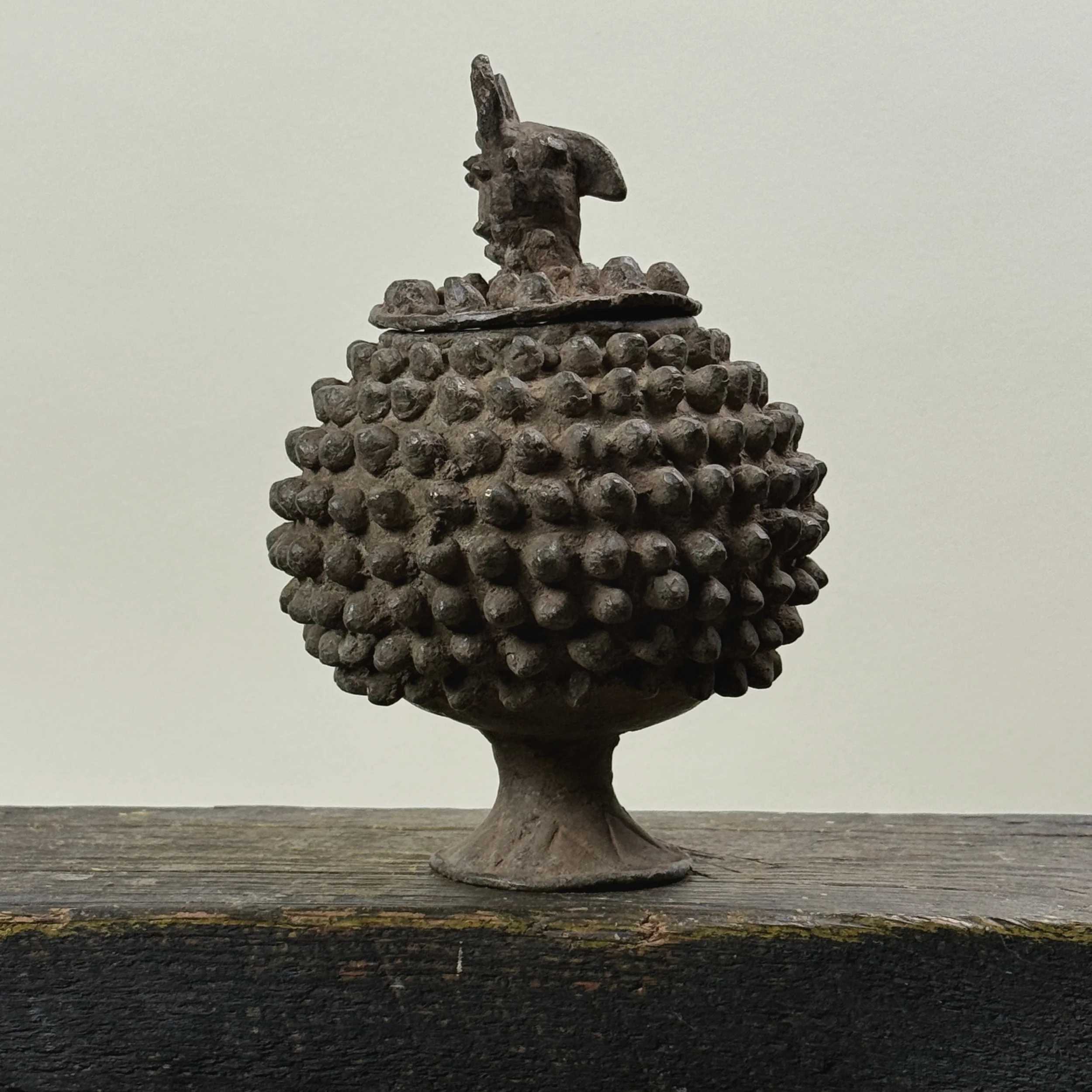 Front view of antique Lobi bronze medicine box with zoomorphic lid