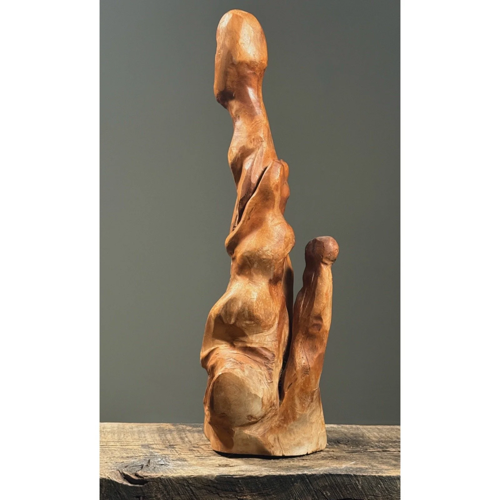 Full frontal view of a vintage abstract folk art figurative root sculpture with natural wood patina