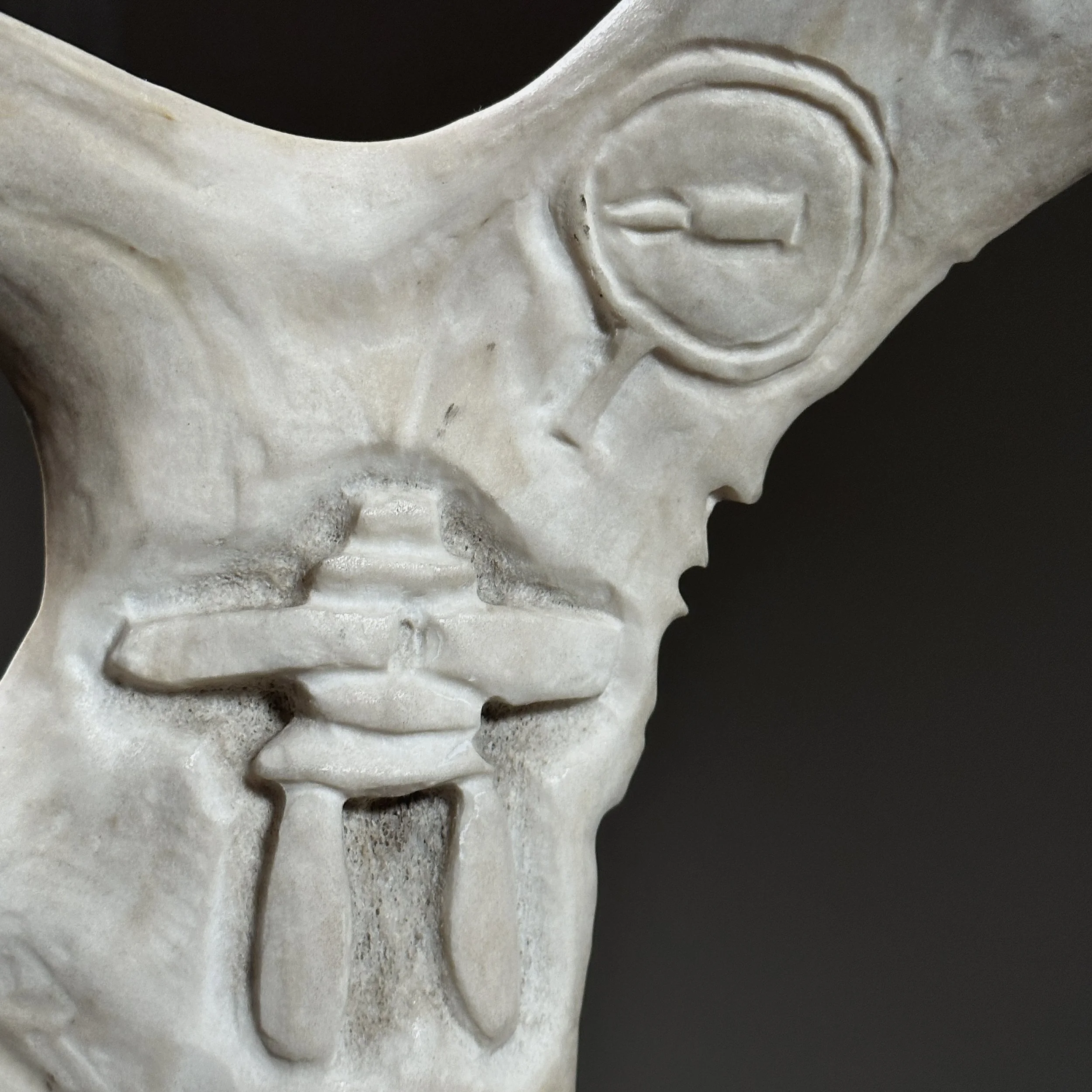 Close-up of antler texture and carving marks.