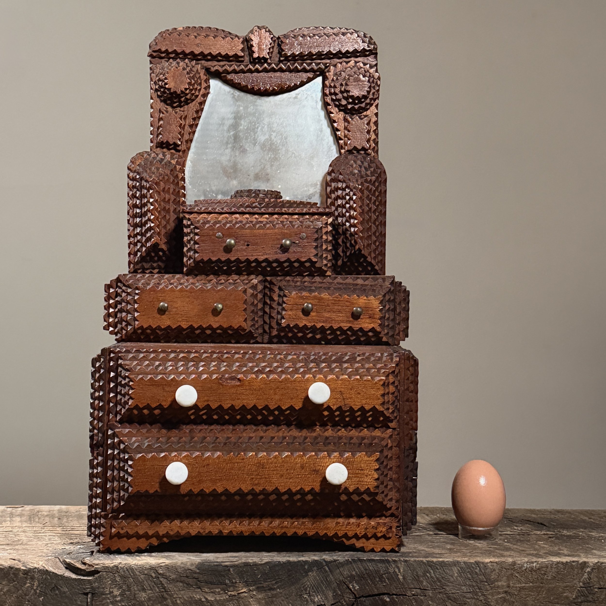 The dresser displayed with an egg for scale.