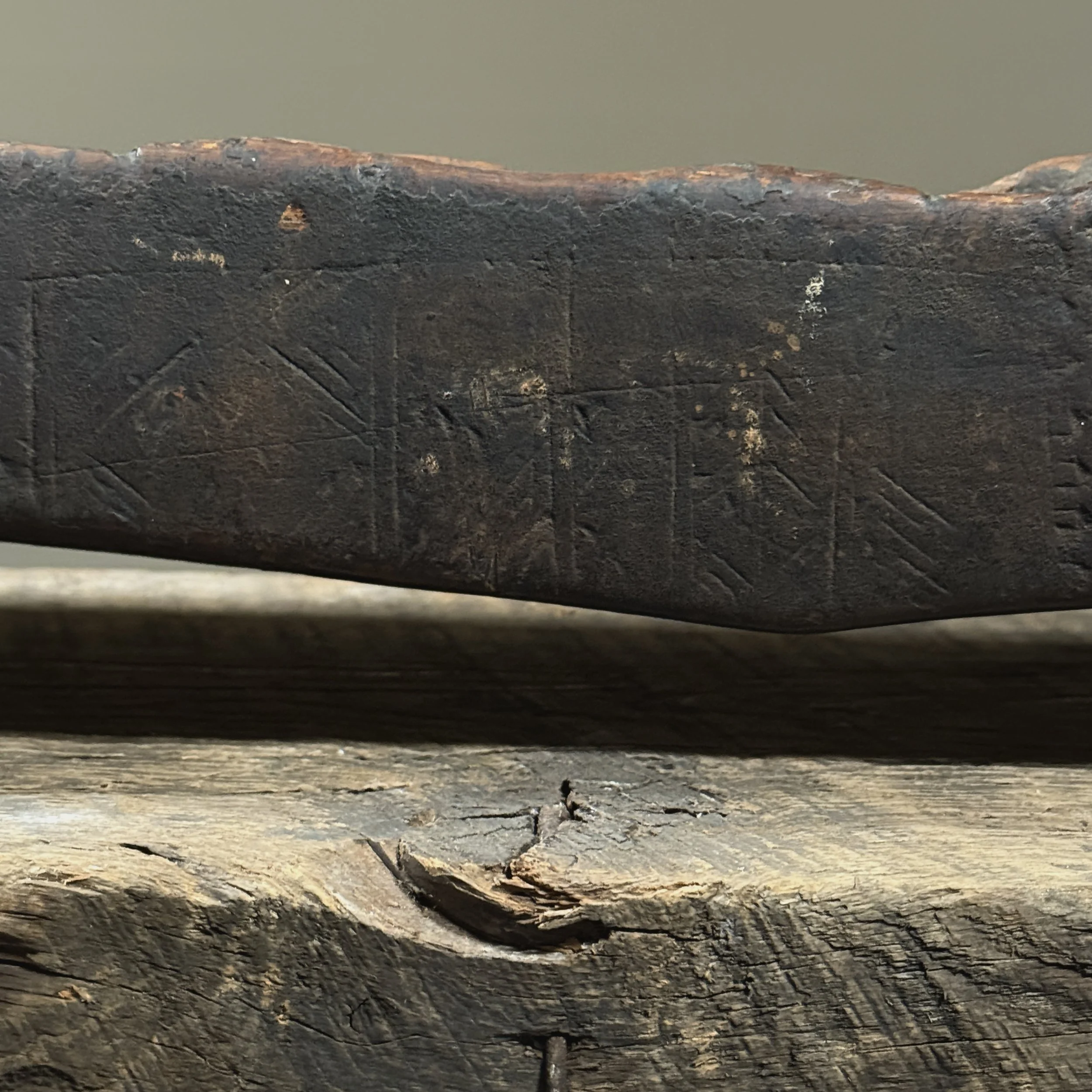 Detail of incised patterns on antique West African mancala sculpture
