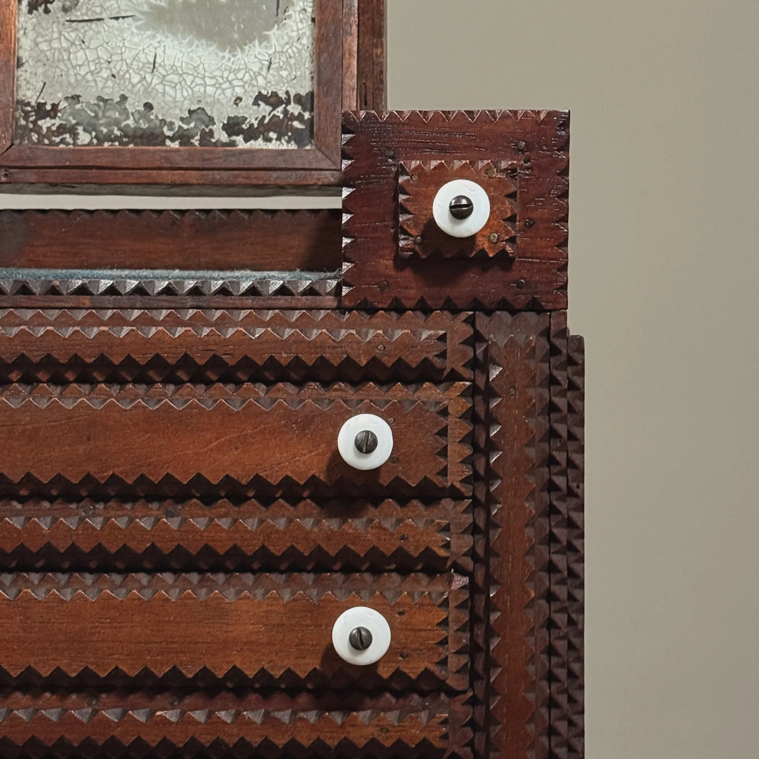 Detail of White knob pulls of drawers.