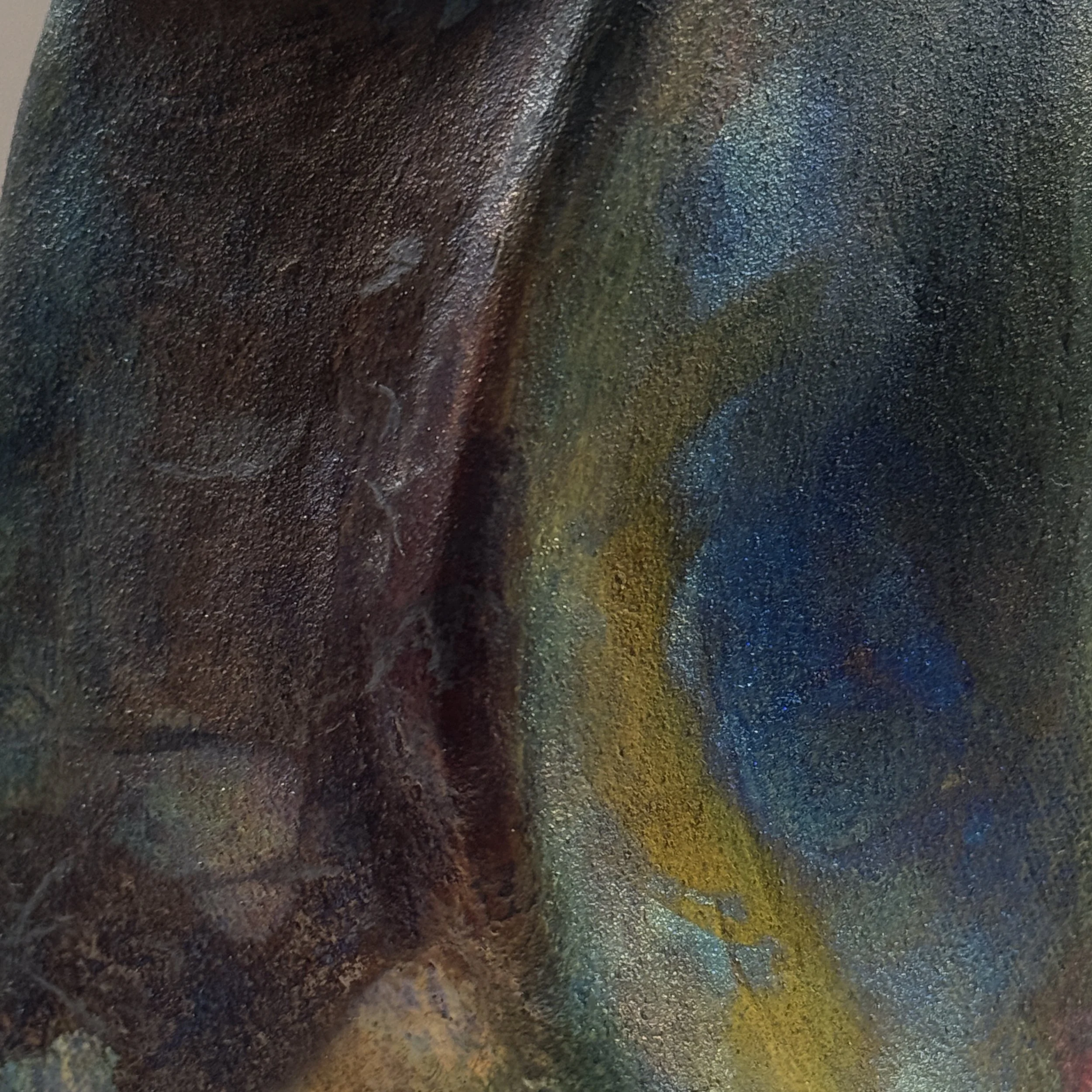 Metallic glaze detail, blackware vessel, red yellow blue accents