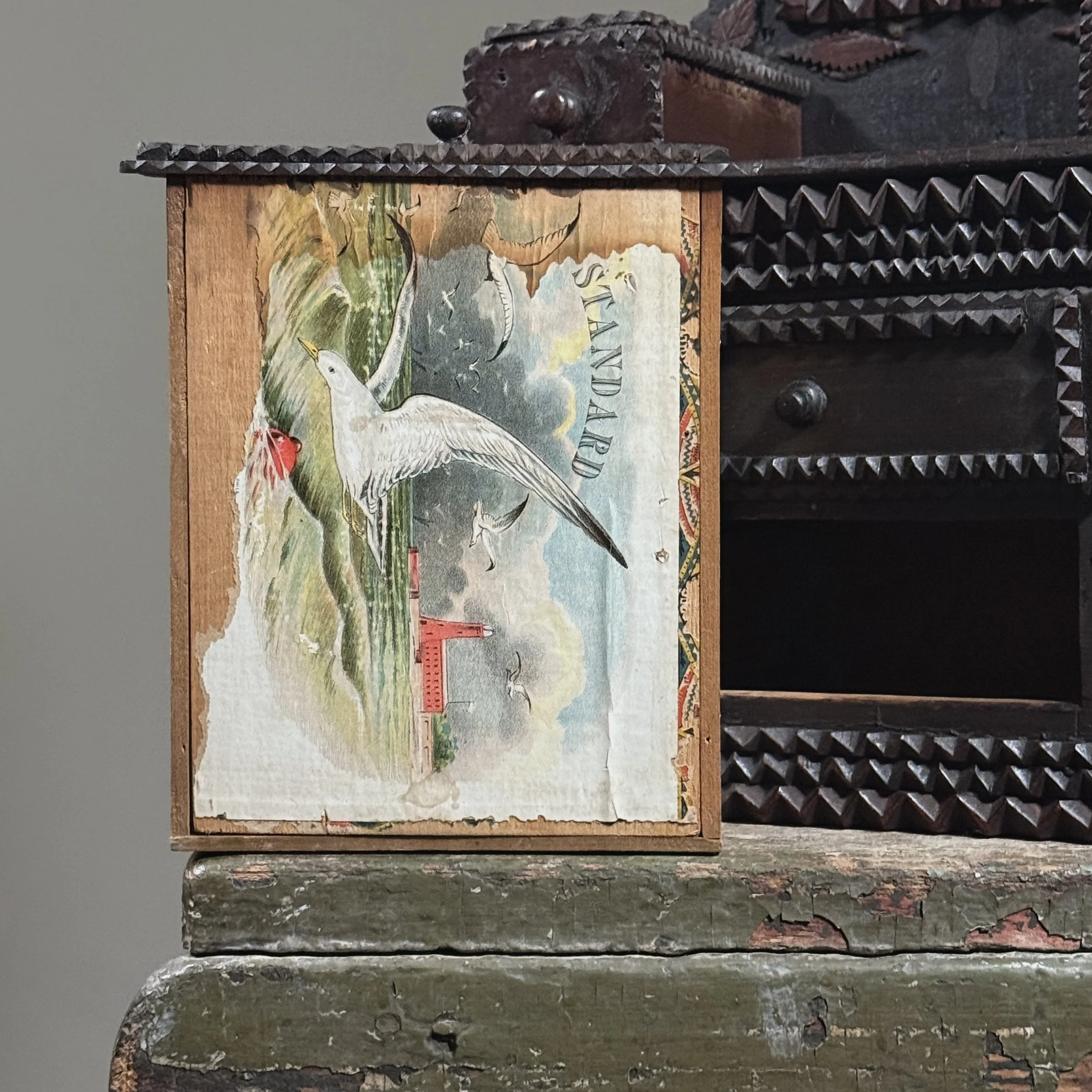 Close-up of the original cigar box label inside a drawer.