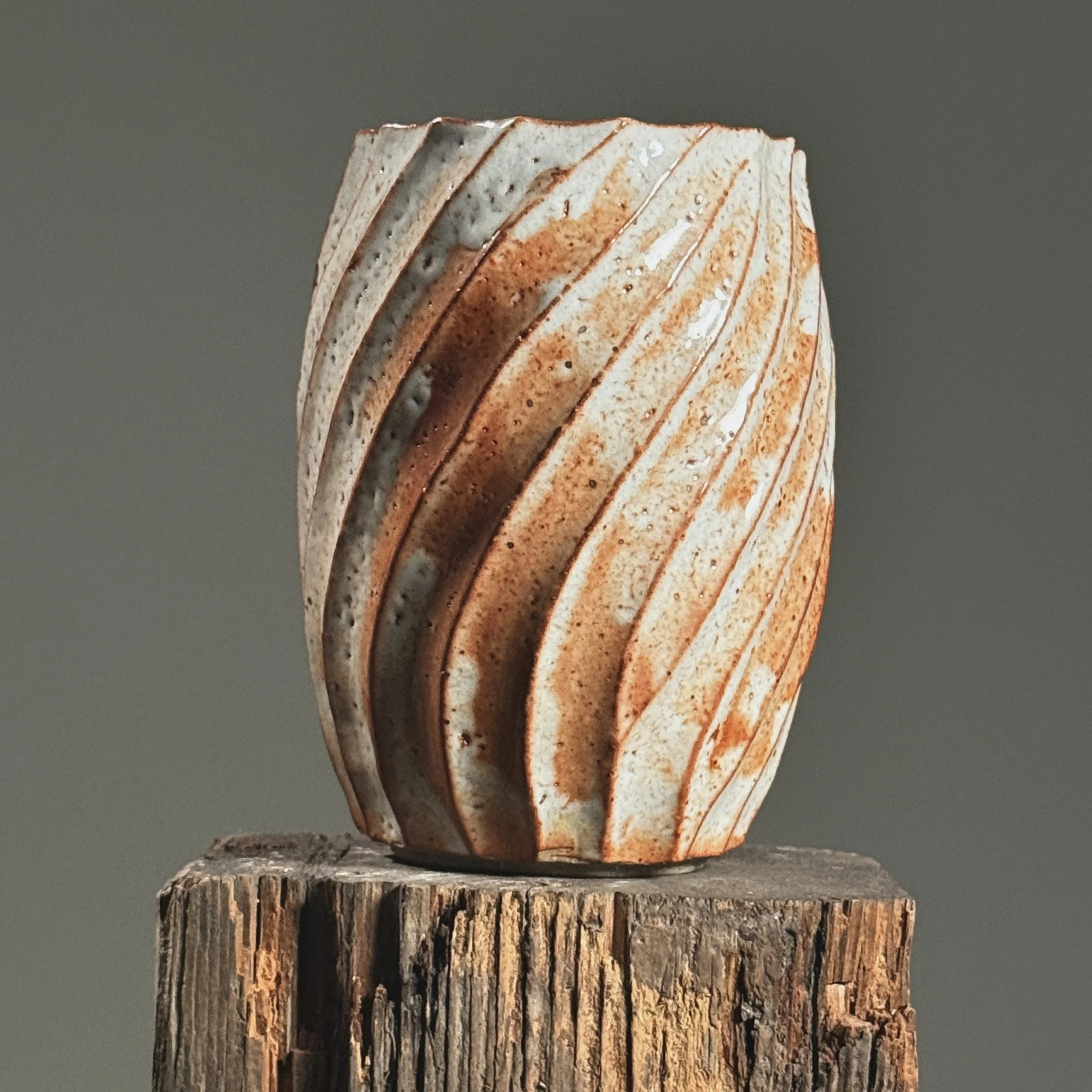 Side profile emphasizing the sculptural swirling shape.