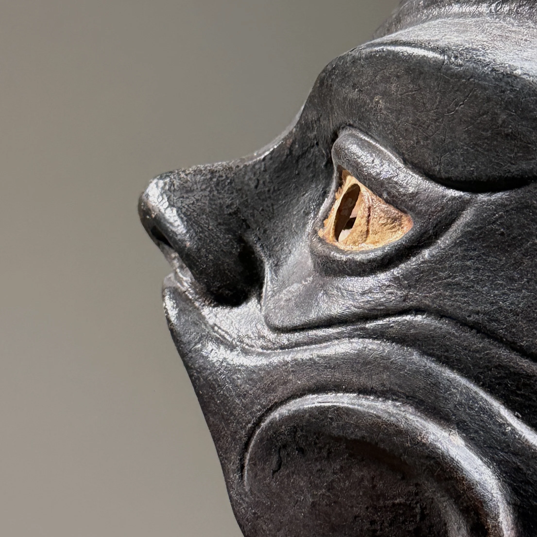 Modernist interpretation of Commedia dell’arte mask in brown leather over sculpted form.