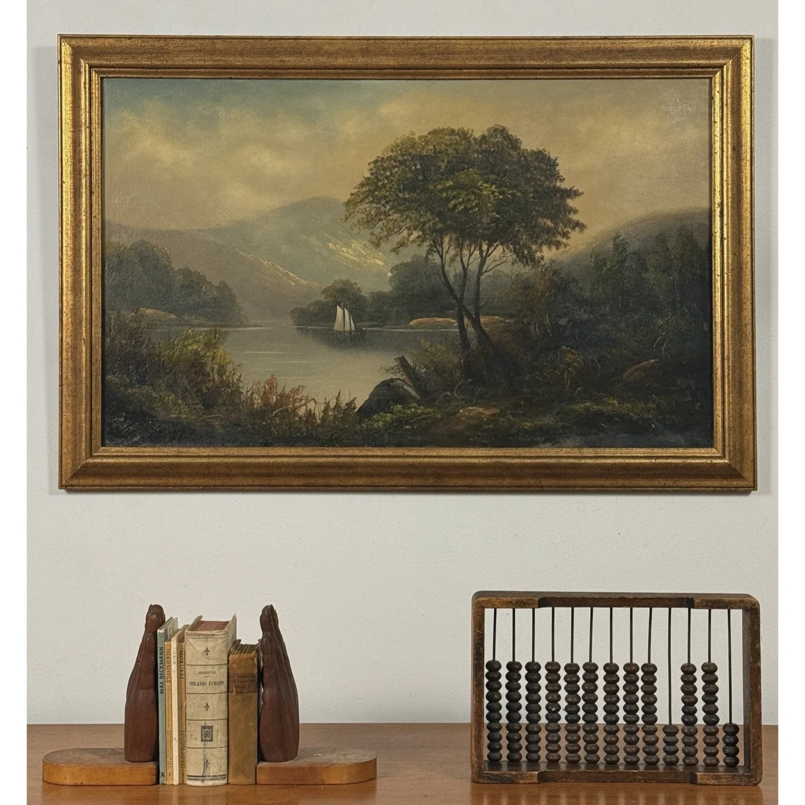 Framed antique Americana landscape oil on canvas vignette.