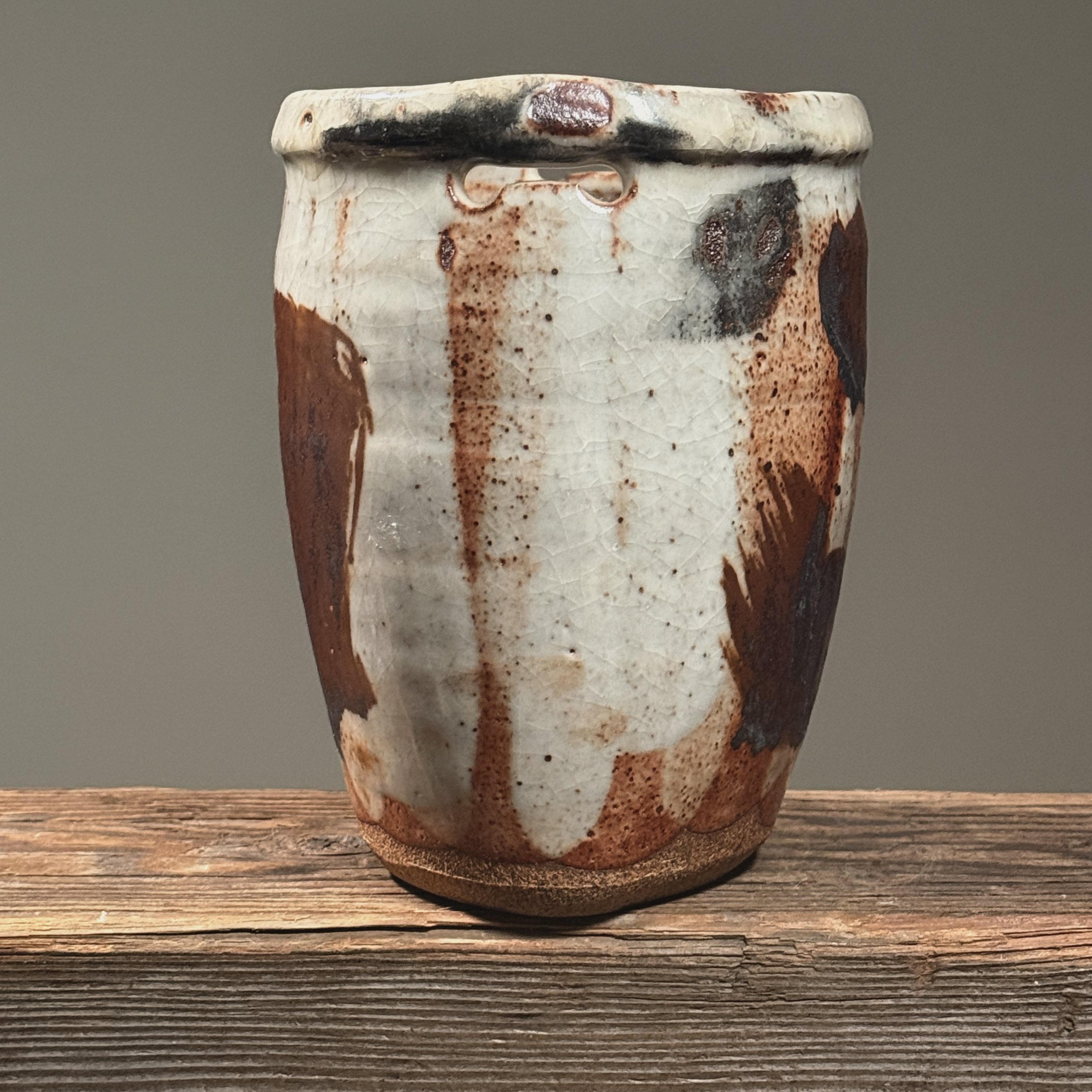Side view showing one of two hanging slits near top edge.