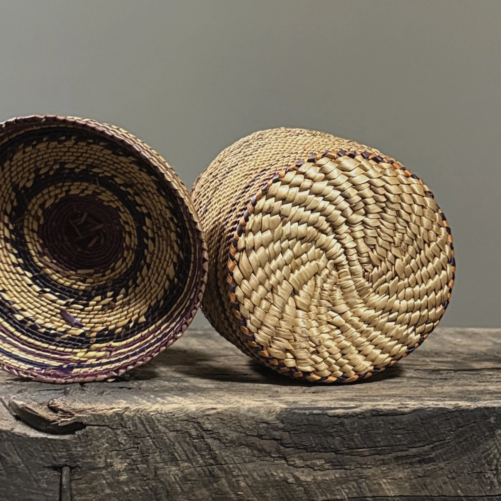 Underside view of an antique Makah basket showing the plaited base construction