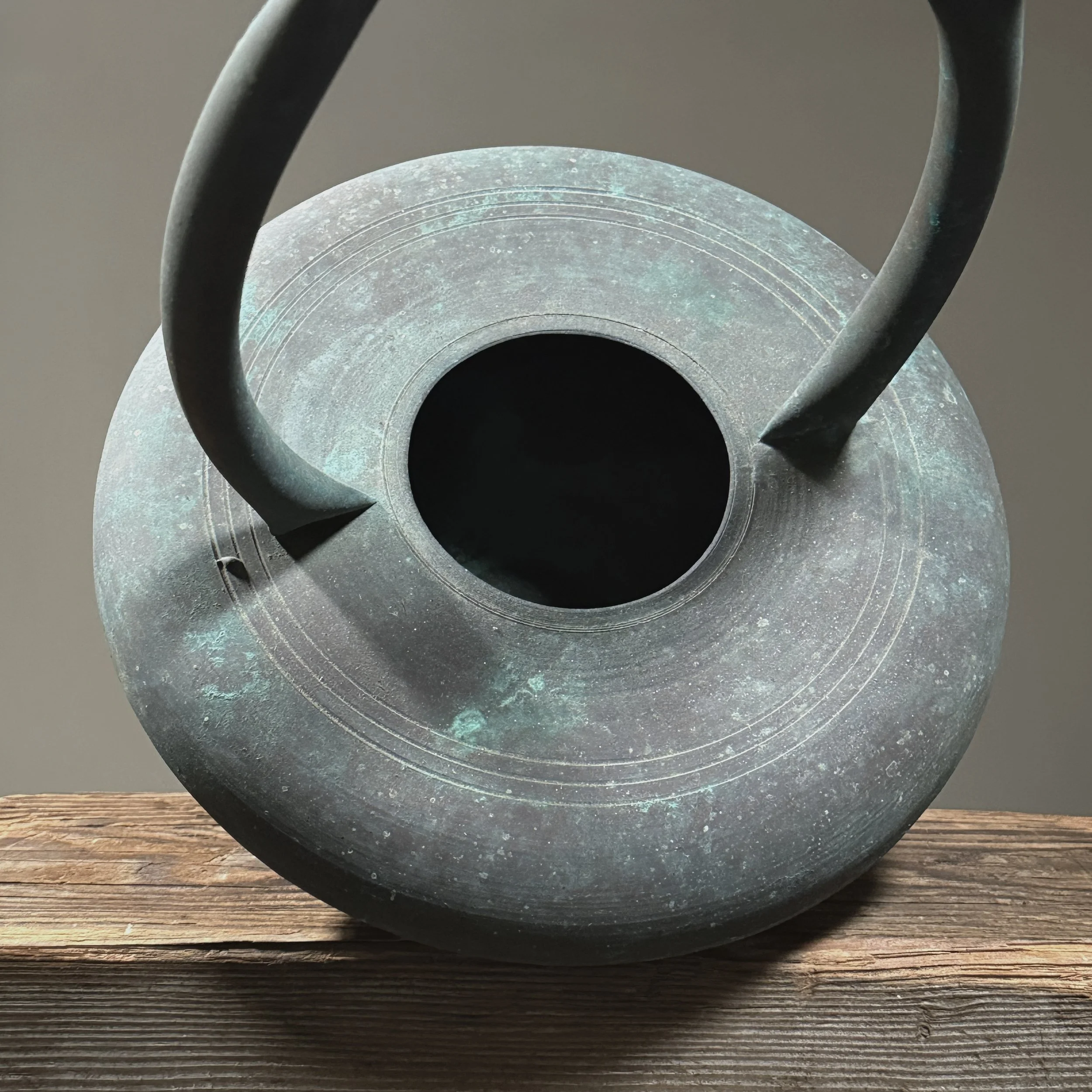Close-up of verdigris finish. Green copper patina. Aged surface.