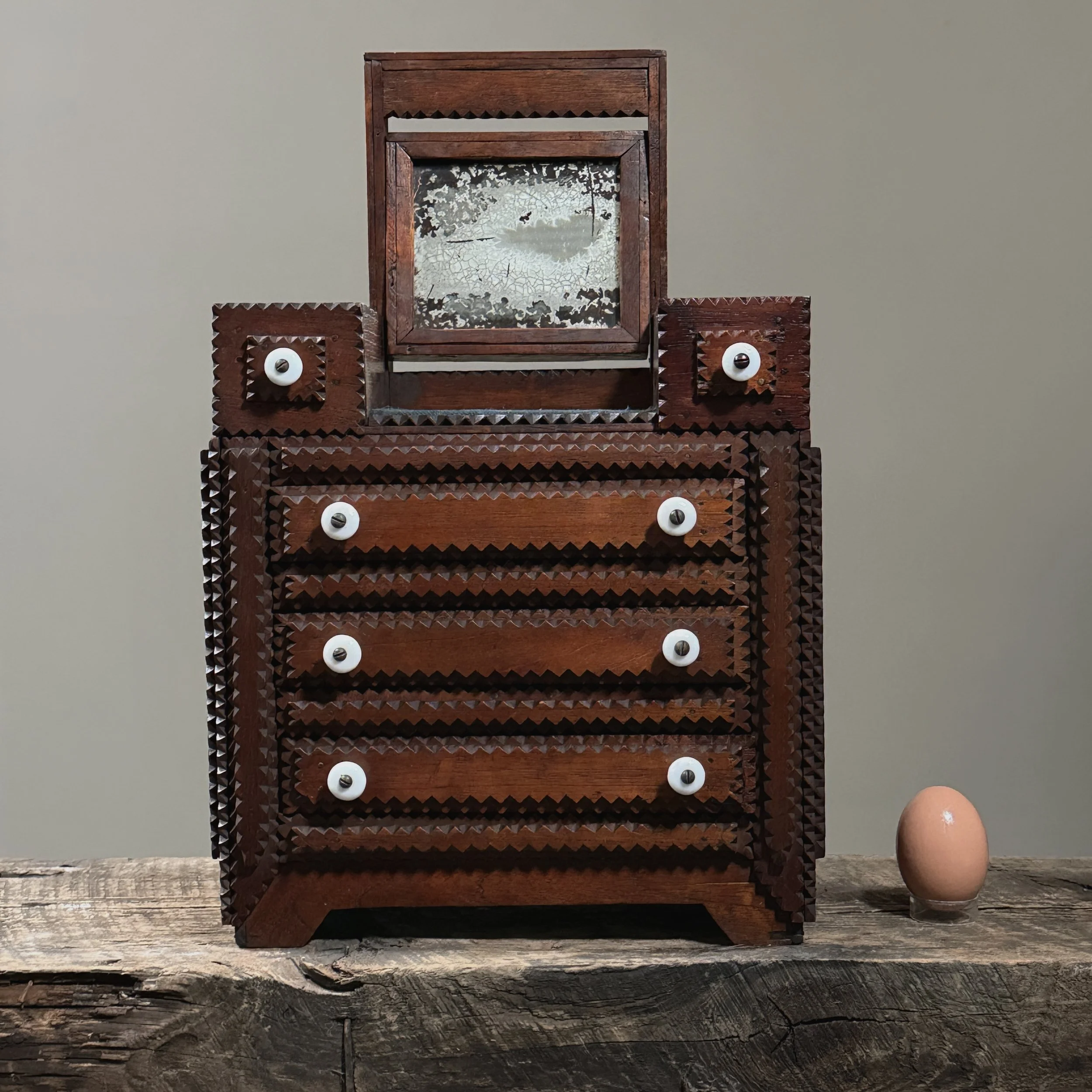 The dresser shown alongside an egg to indicate size.