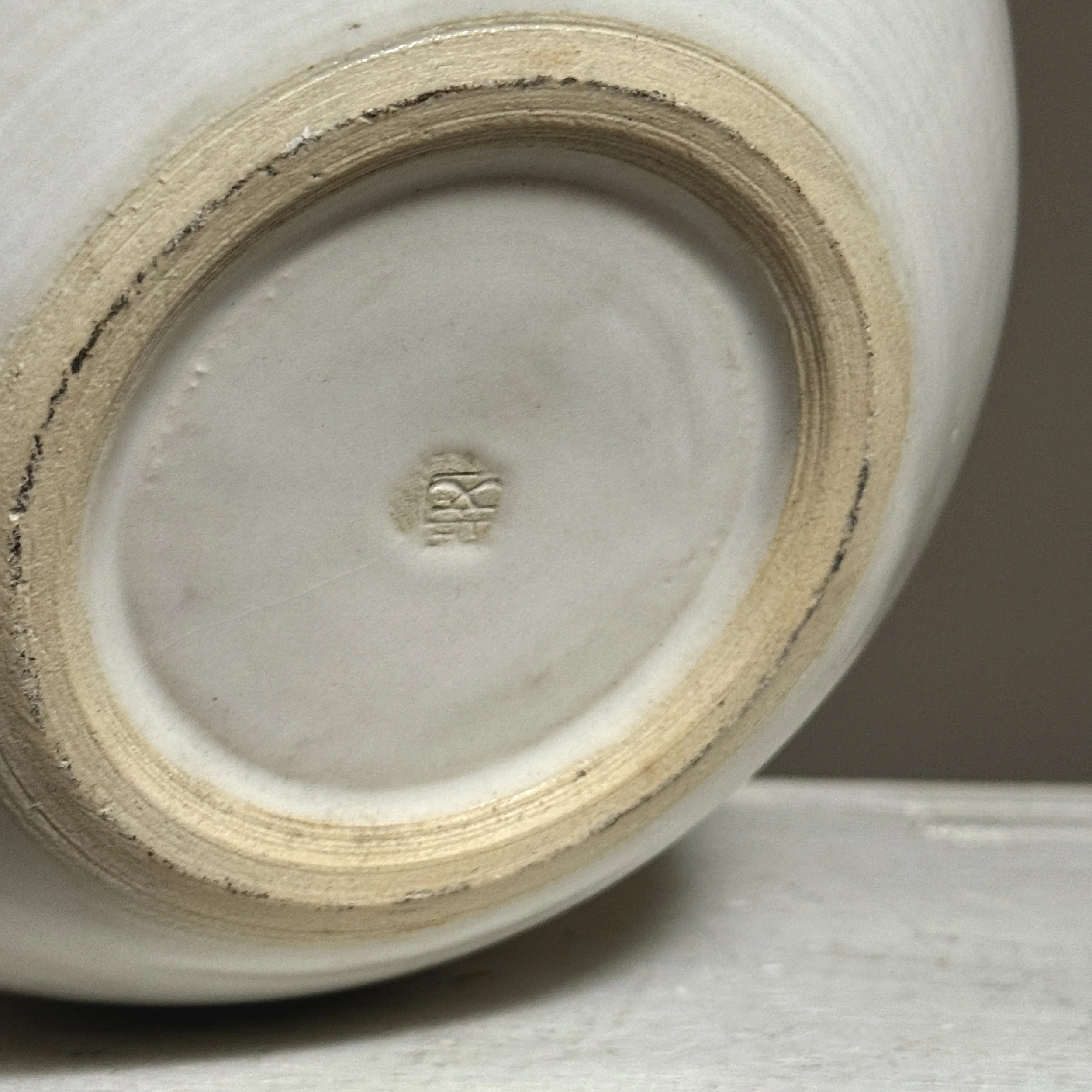 The vessel's base with artist's signature