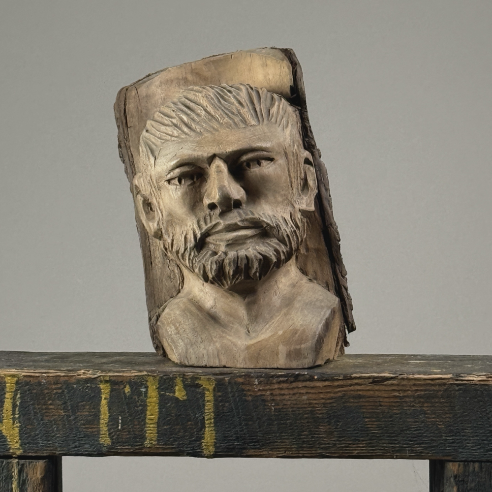Vintage hand-carved folk art portrait of a bearded man sculpture