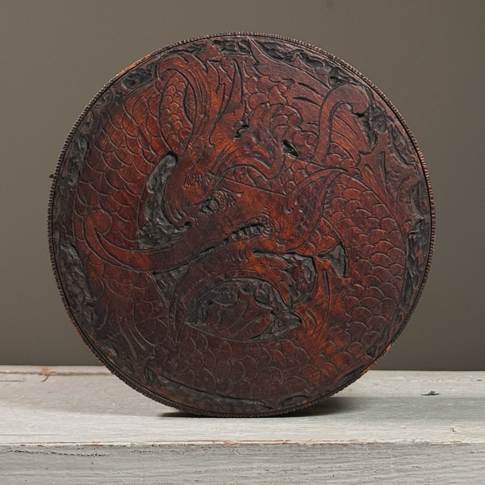 Antique folk art hand carved lidded box. Dragon on top. 6.75 inch diameter by 2.75 inch height.