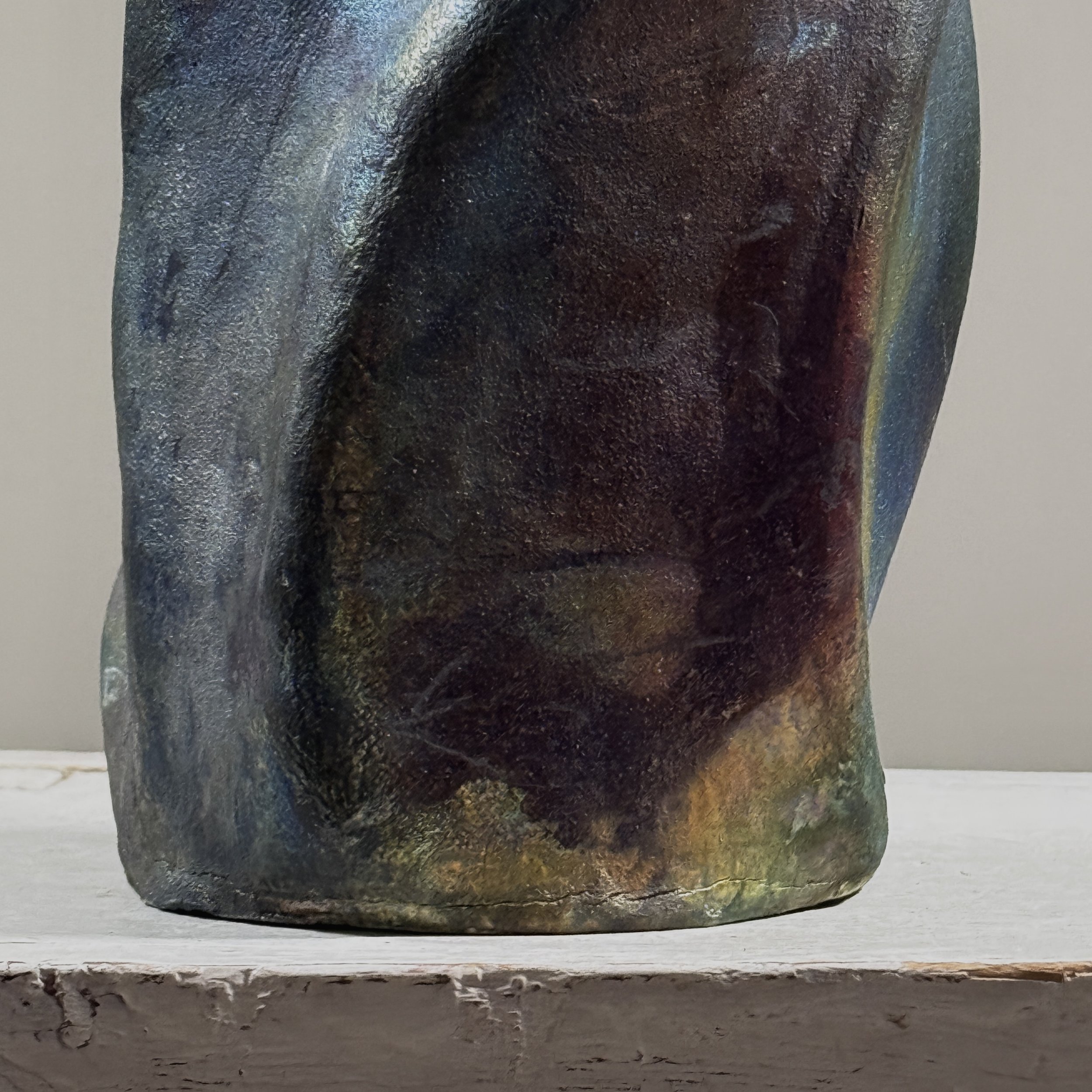 Metallic glaze detail, blackware vessel, red yellow blue accents