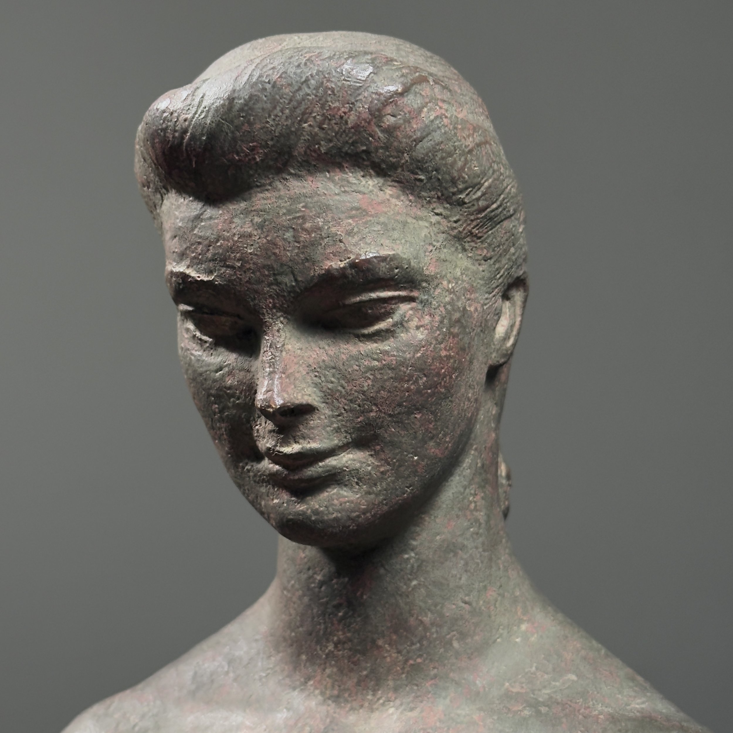 Close-up of facial features and surface patina