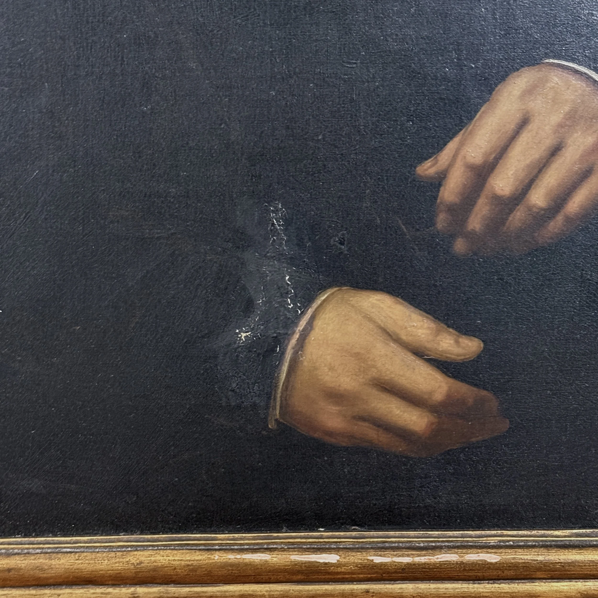 Detail of canvas abrasion and surface disruption near the sitter's proper right hand and cuff.
