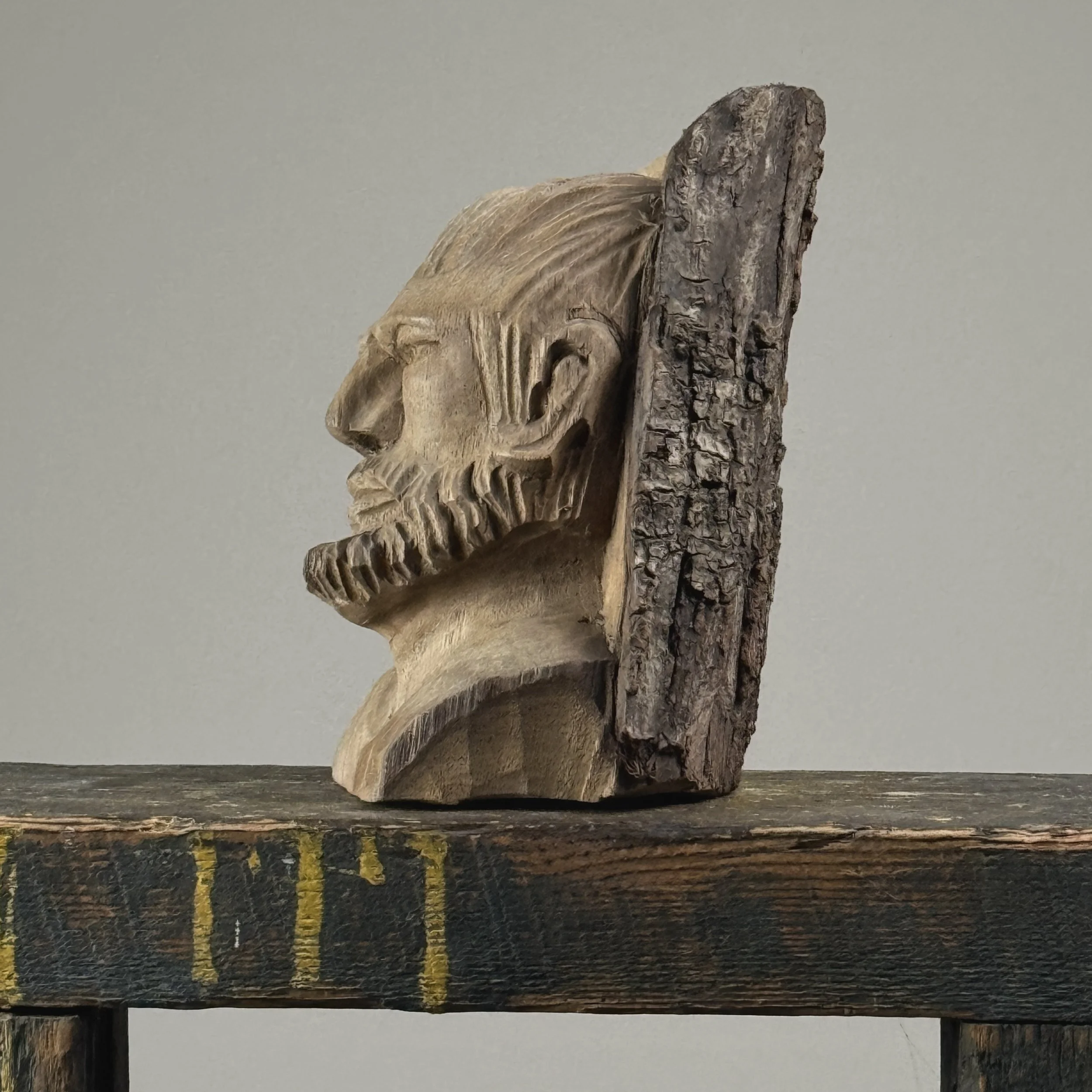 Vintage hand-carved folk art portrait of a bearded man sculpture