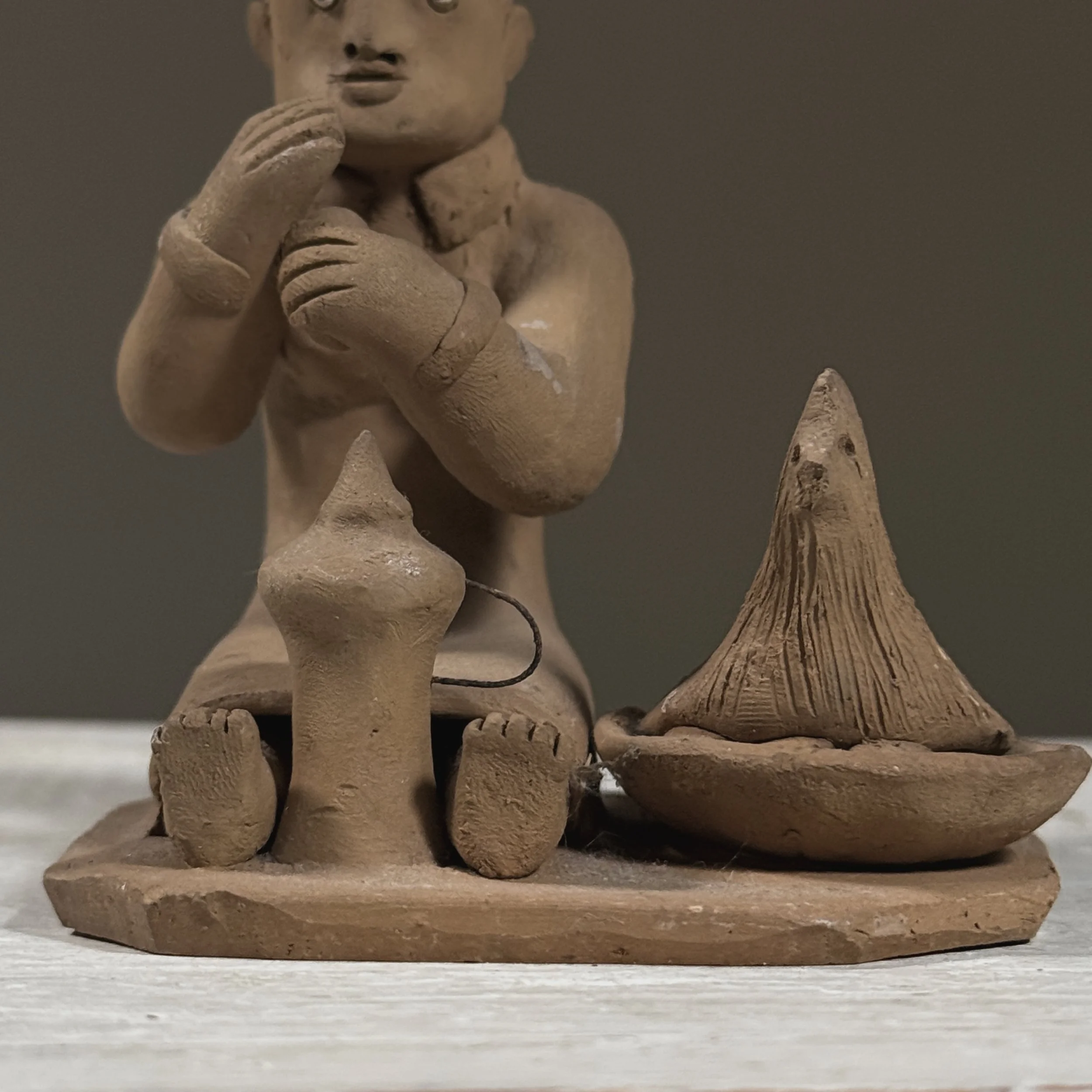 Close-up of the hen and the cluster of clay eggs.